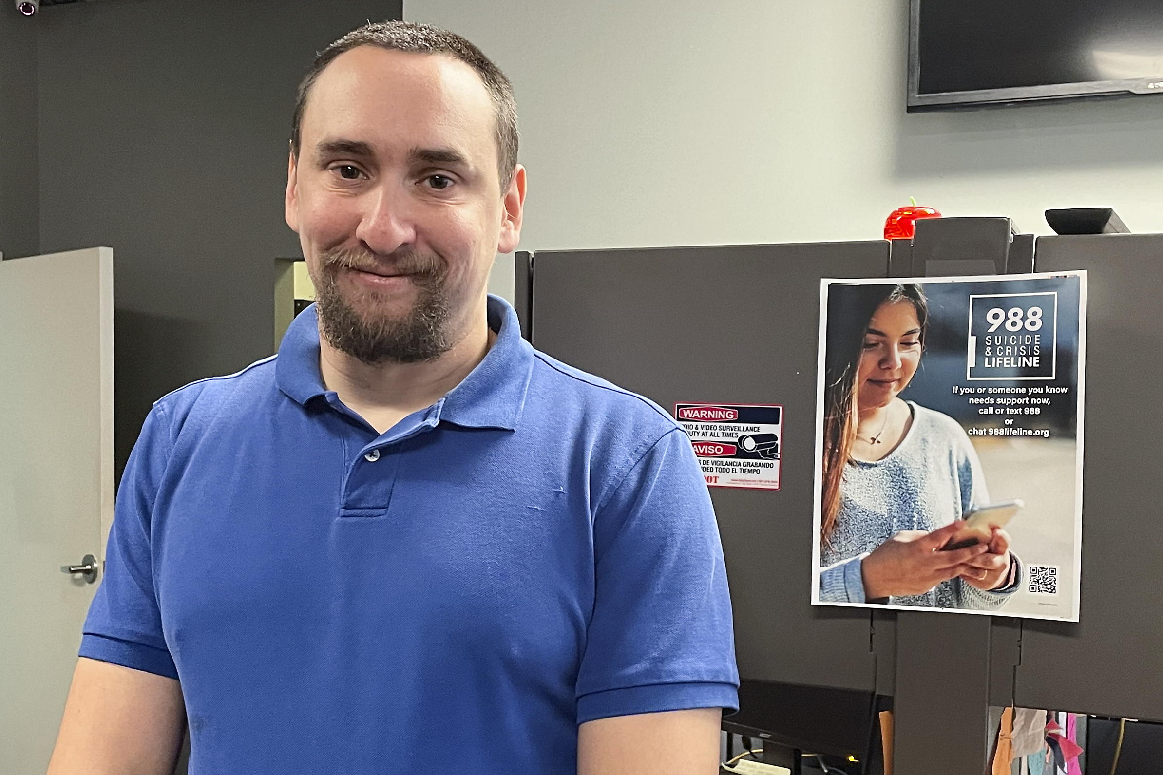 988 Call Center Director Jamieson Brill at a facility in Hyattsville, Md., Oct. 7, 2022. Brill works in one of more than 200 call centers fanned out around the country tasked with answering an uptick in calls.