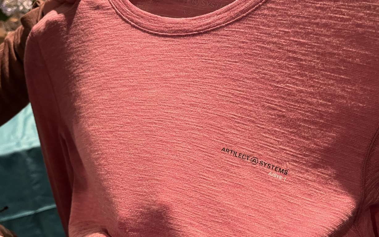 Monica Ebert, a business development manager for The Woolmark Company, holds up an Artilect Systems shirt made from Merino wool during the Outdoor Retailer media preview at the Hyatt Regency Salt Lake in Salt Lake City on Monday.