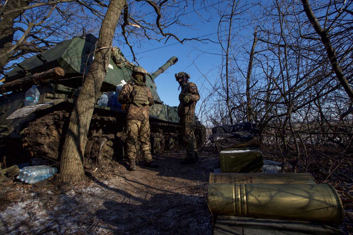 Ukrainian servicemen stand next to a 2S3 Akatsiya self-propelled howitzer at their position in a frontline, amid Russia's attack on Ukraine, in Donetsk region, Ukraine, on Sunday.