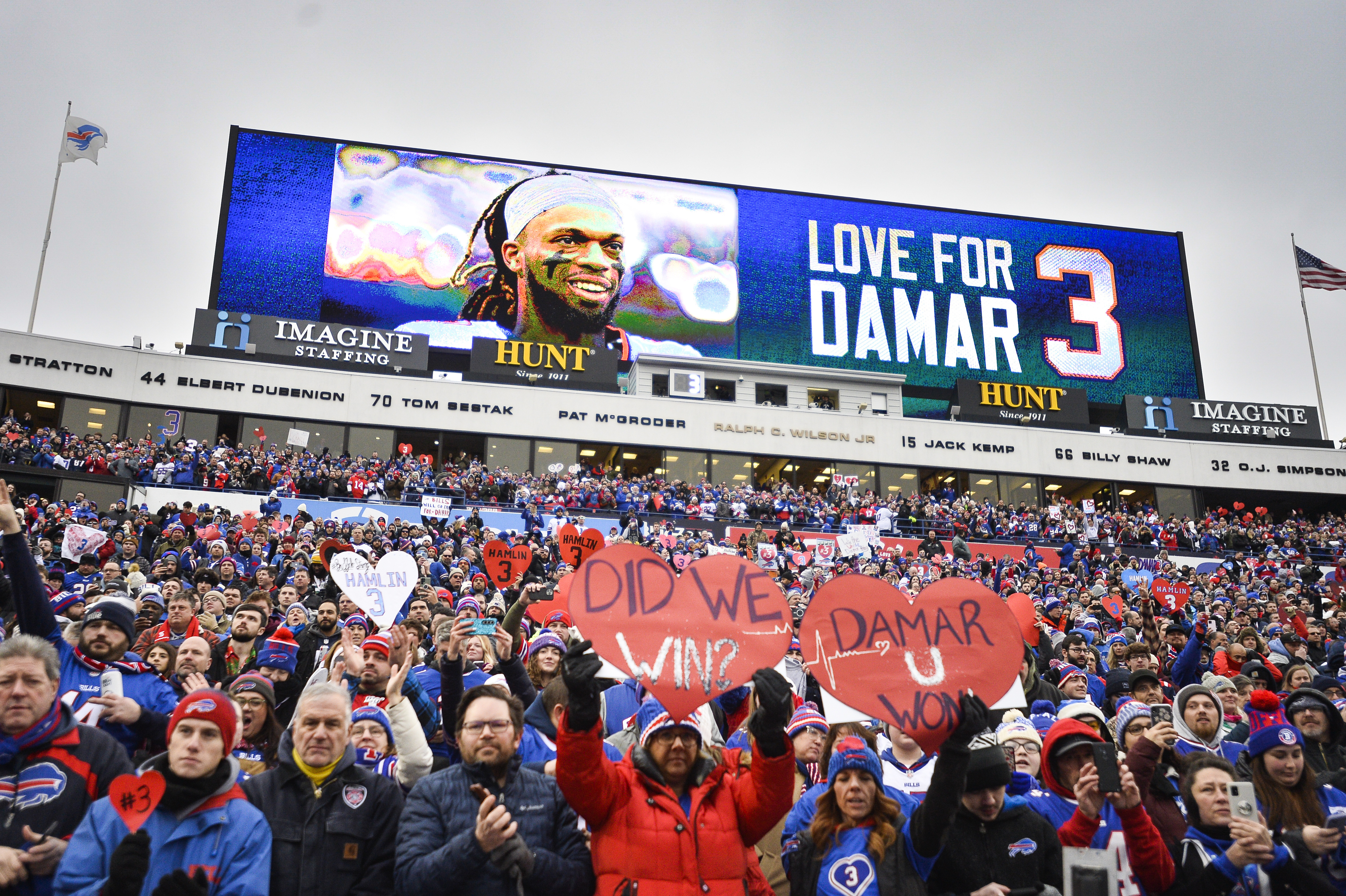 FILE - Fans stand in support for Buffalo Bills safety Damar Hamlin (3) before an NFL football game against the New England Patriots, Sunday, Jan. 8, 2023, in Orchard Park, N.Y. Damar Hamlin plans to support young people through education and sports with the $8.6 million in GoFundMe donations that unexpectedly poured into his toy drive fundraiser after he suffered a cardiac arrest in the middle of a game last week. 