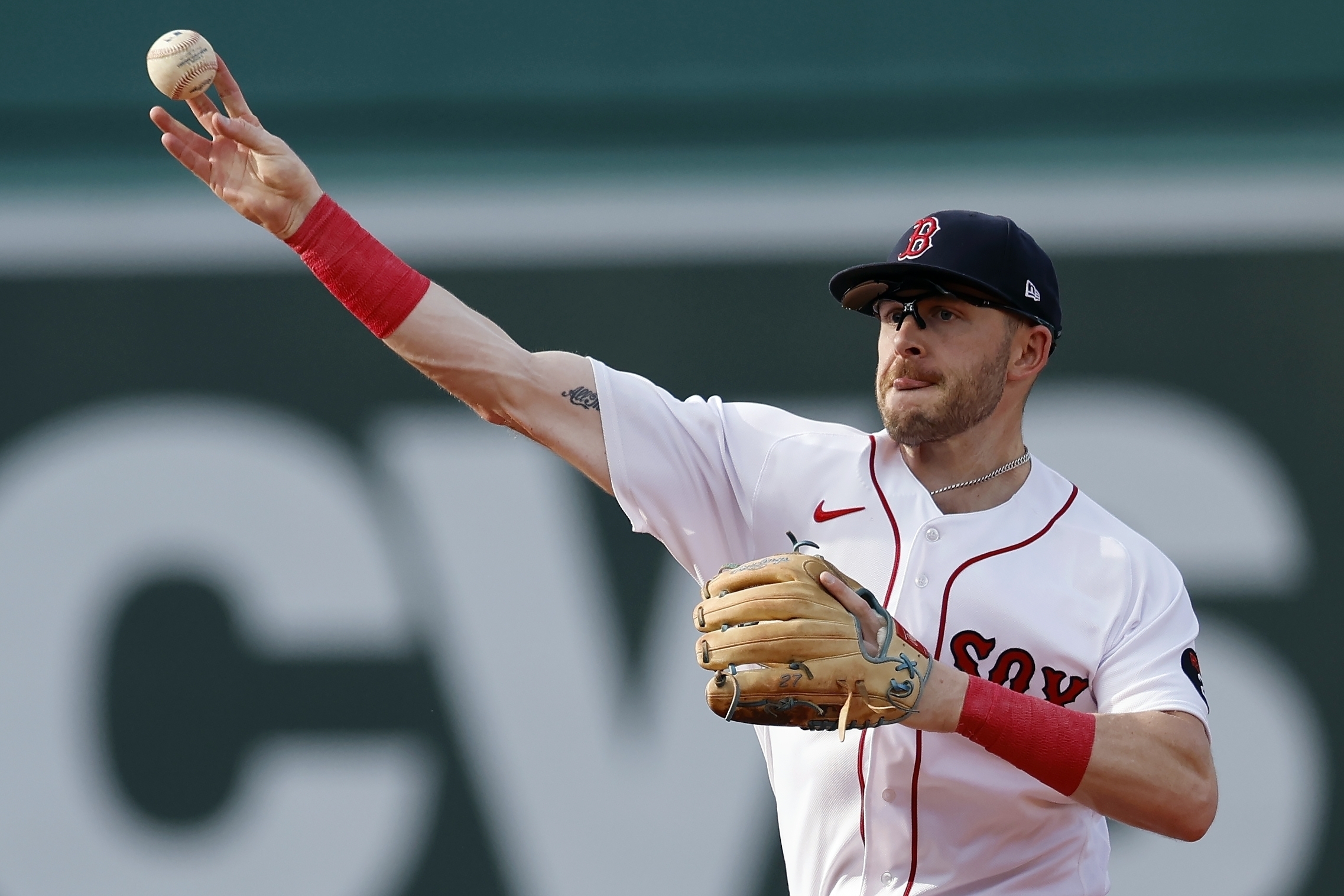 FILE - Boston Red Sox's Trevor Story throws to first base on the force out single by Texas Rangers' Marcus Semien during the third inning of a baseball game, Saturday, Sept. 3, 2022, in Boston. Red Sox infielder Trevor Story had surgery on his throwing elbow and appears likely to miss a significant portion of the 2023 season. Boston said Tuesday, Jan. 10, 2023, that Story underwent an internal bracing procedure on his right ulnar collateral ligament a day earlier. Texas Rangers team physician Dr. Keith Meister operated at Texas Metroplex Institute in Arlington, Texas. 
