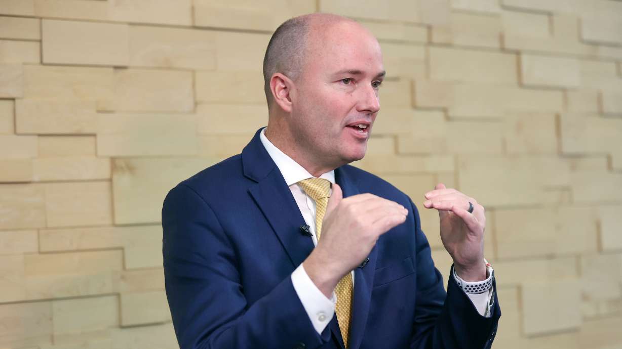 Gov. Spencer Cox speaks to members of the media during a Social Media and Youth Mental Health Symposium at O.C. Tanner in Salt Lake City on Tuesday.