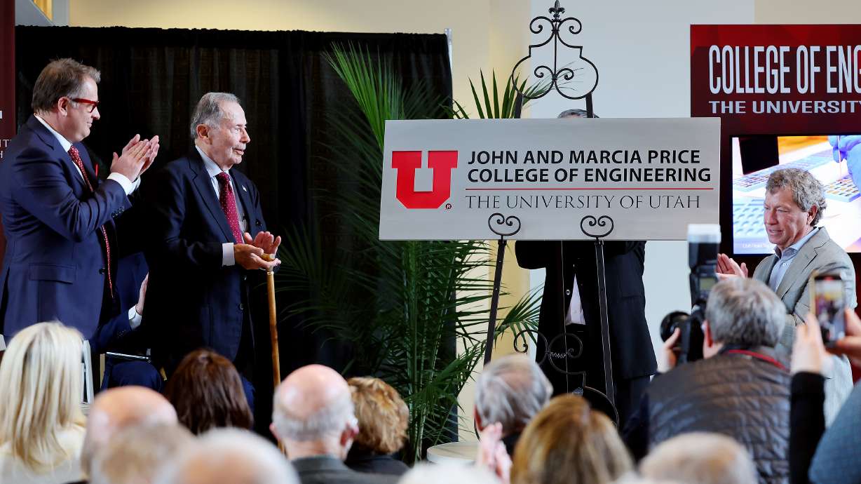 University of Utah President Taylor Randall, former U.S. Ambassador John Price and J. Steven Price and others applaud as the U.'s College of Engineering is renamed the John and Marcia Price College of Engineering at a ceremony in Salt Lake City Tuesday.