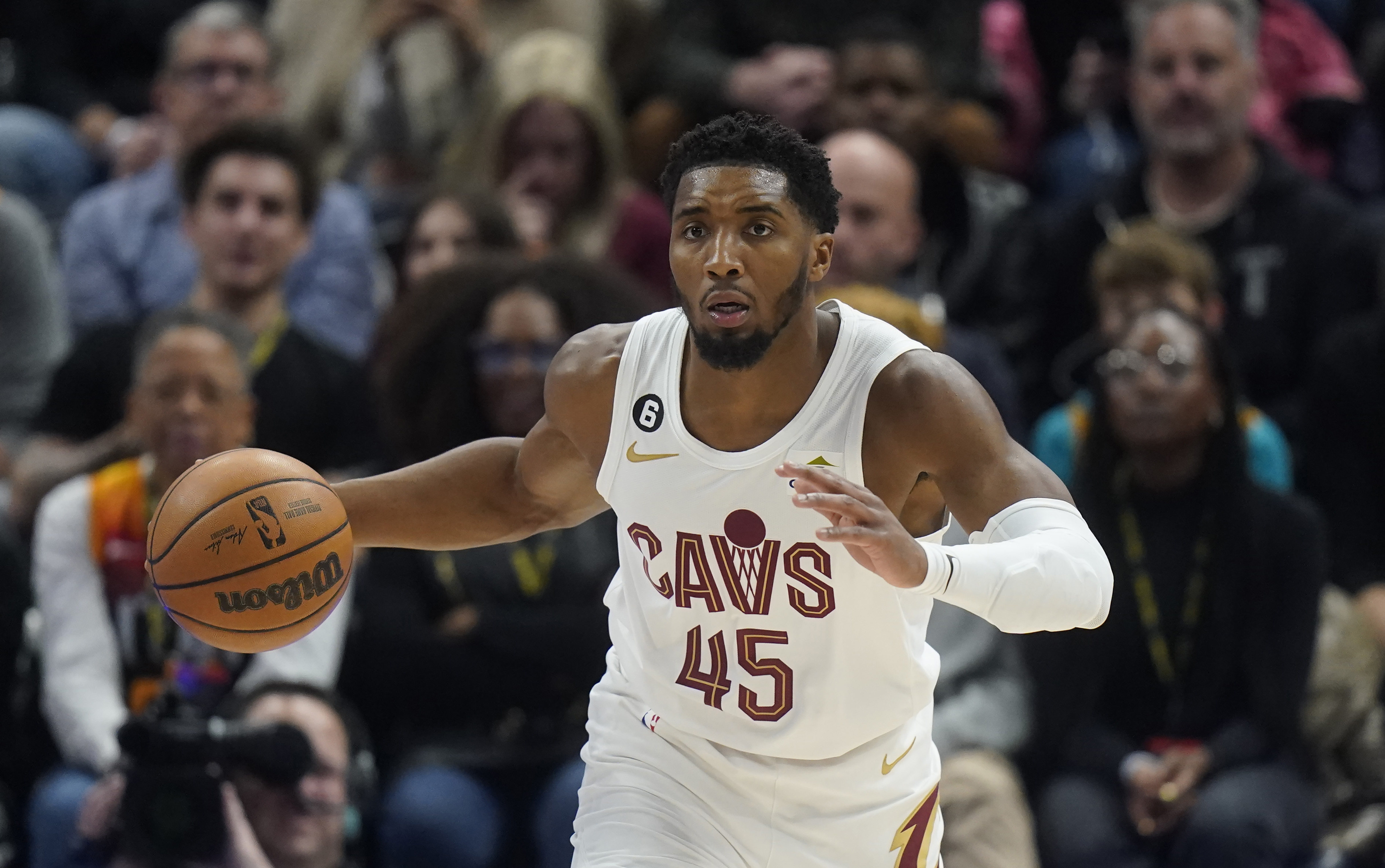 Cleveland Cavaliers guard Donovan Mitchell (45) brings the ball up during the first half of the team's NBA basketball game against the Utah Jazz on Tuesday, Jan. 10, 2023, in Salt Lake City. 