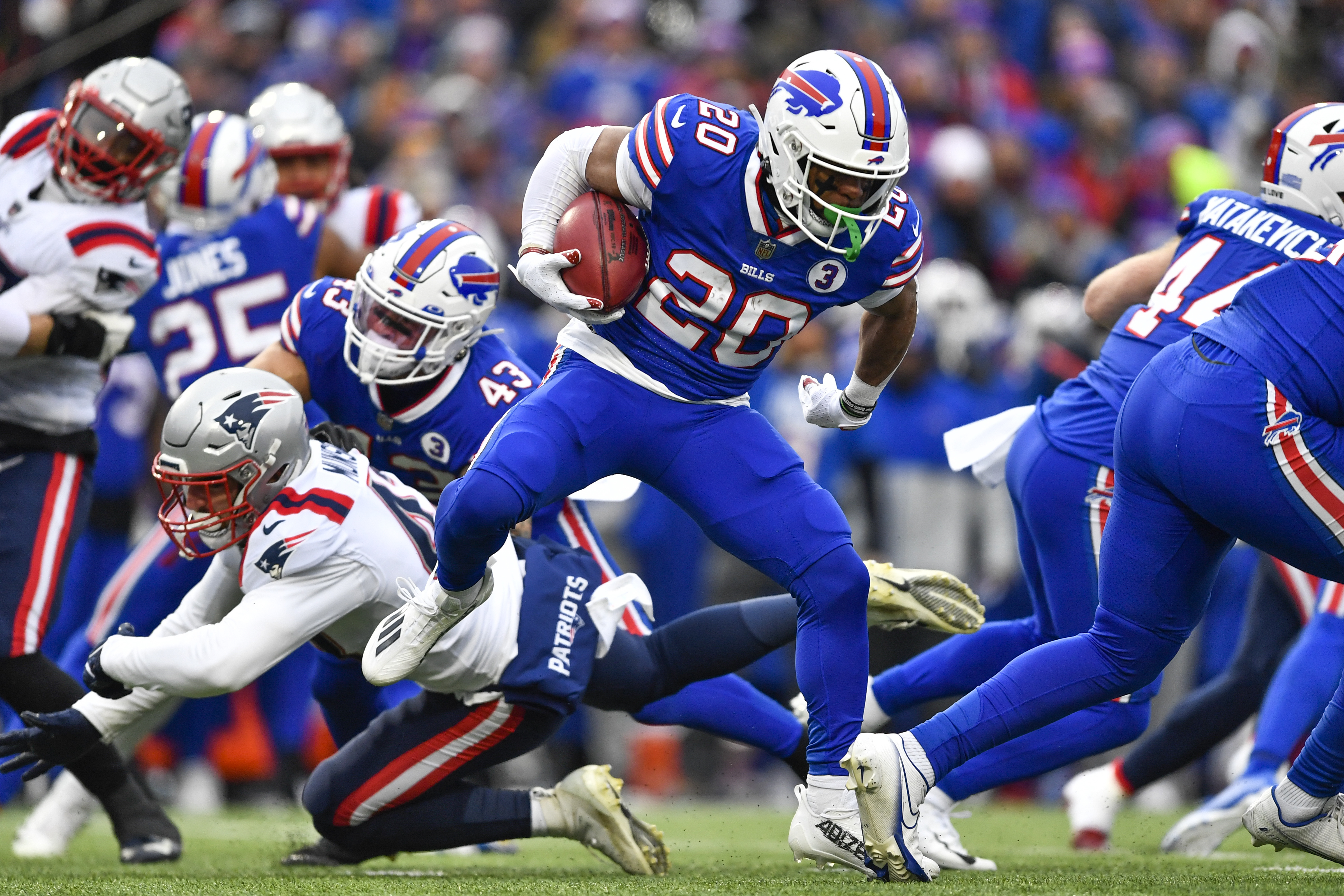 Buffalo Bills running back Nyheim Hines (20) runs in a touchdown on a kickoff return during the first half of an NFL football game against the New England Patriots, Sunday, Jan. 8, 2023, in Orchard Park. 