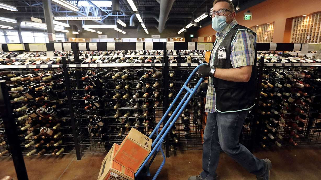 Justin Robertson works at state liquor store in Salt Lake City on Oct. 23, 2020. Over the past five years, Utah has seen an increase in alcohol sales. This past fiscal year was no exception with a 7.7% increase.