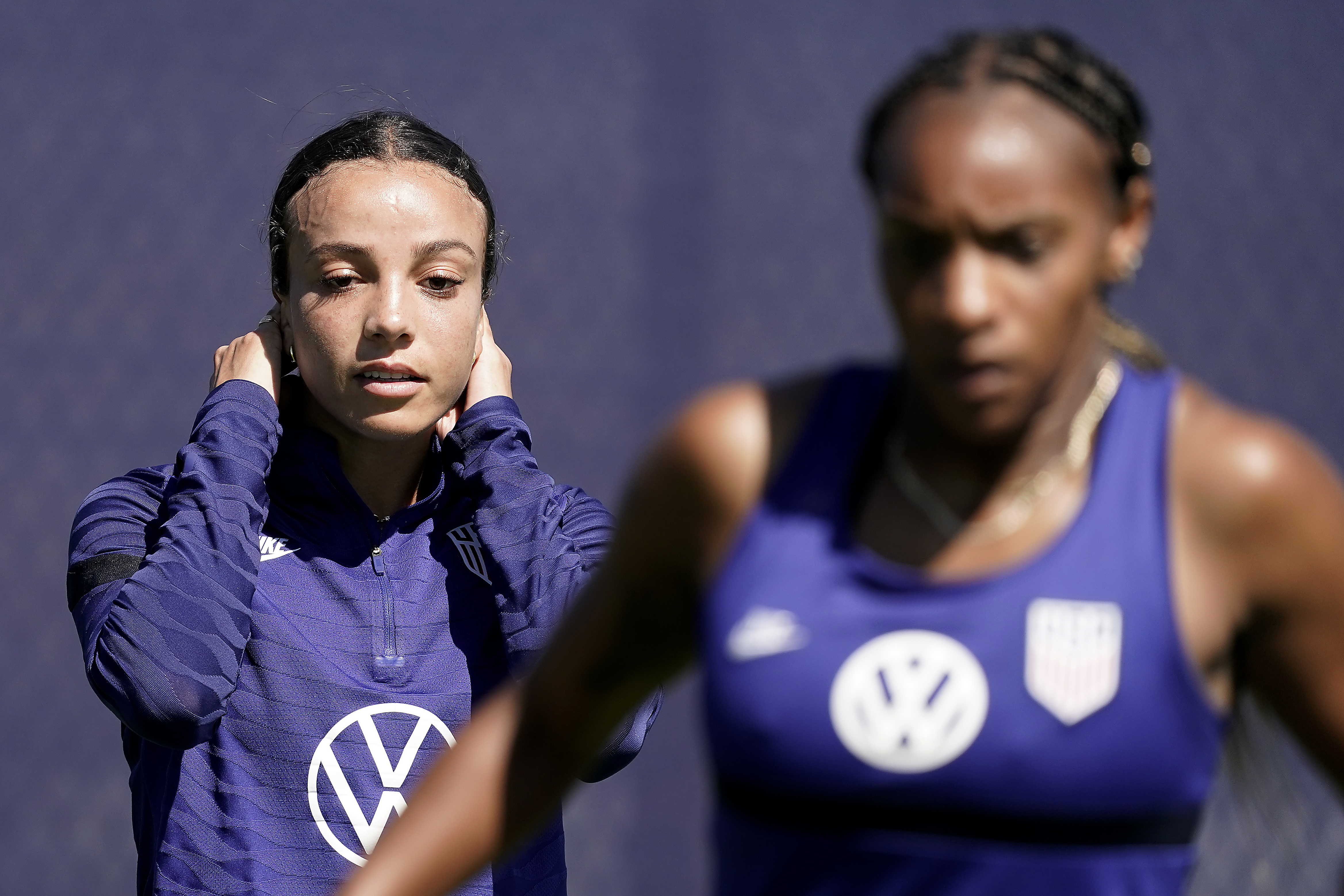 U.S. national team players Crystal Dunn, right, and Sophie Smith practice for a match against Nigeria Tuesday, Aug. 30, 2022, in Riverside, Mo. Women’s soccer in the United States has struggled with diversity, starting with a pay-to-play model that can exclude talented kids from communities of color. 