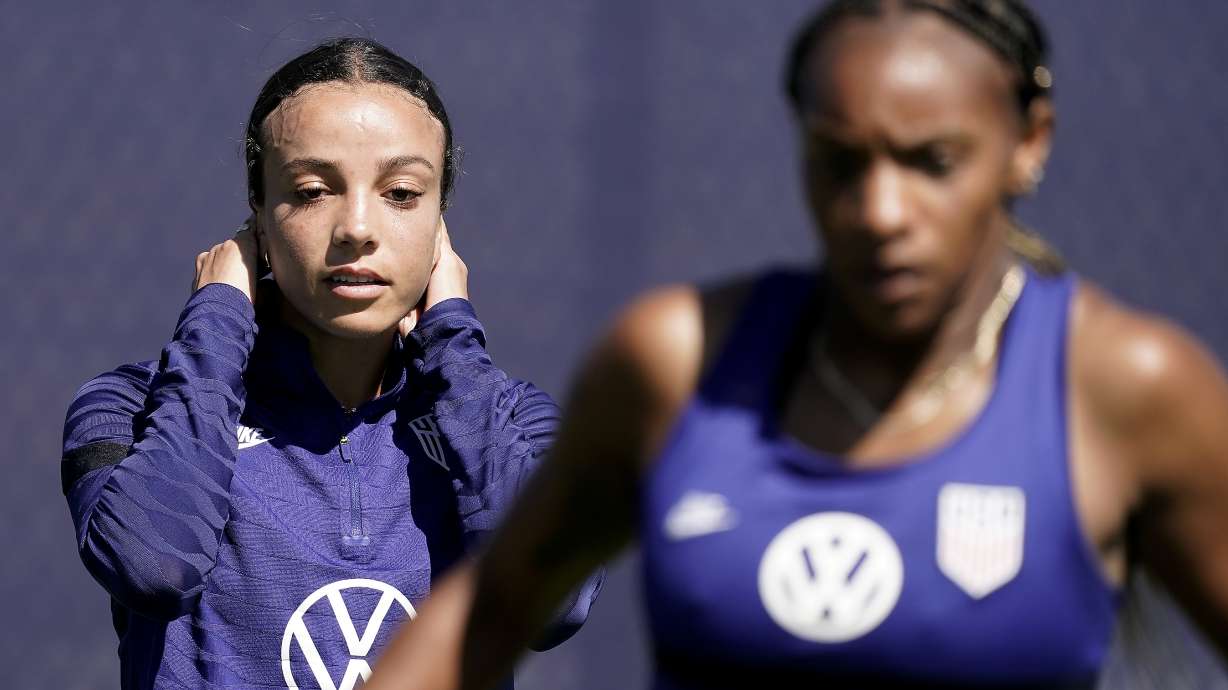 U.S. national team players Crystal Dunn, right, and Sophie Smith practice for a match against Nigeria Tuesday, Aug. 30, 2022, in Riverside, Mo. Women’s soccer in the United States has struggled with diversity, starting with a pay-to-play model that can exclude talented kids from communities of color.