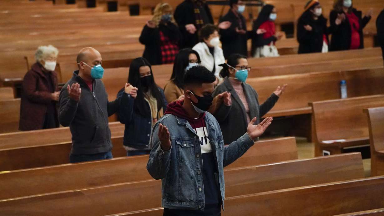 Worshipers gather for a Christmas Eve mass inside Cathedral of Our Lady of the Angels Thursday, Dec 24, 2020, in Los Angeles.