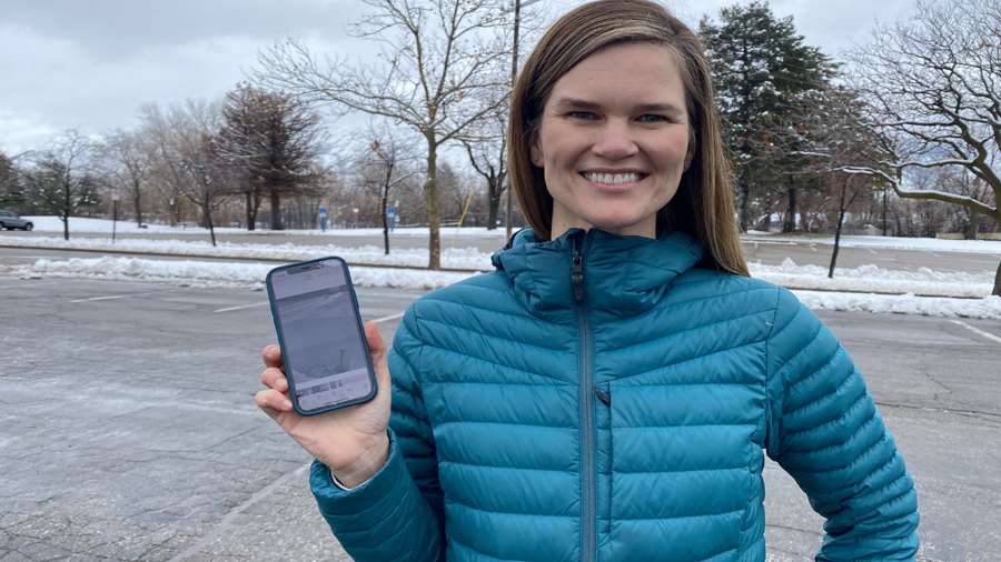 Dr. McKenzie Skiles, an assistant professor of geography at the University of Utah, studies the snowpack in a snow pit near Alta.