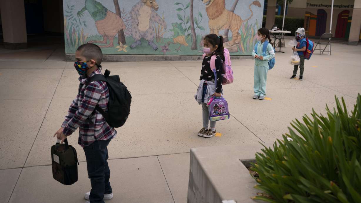 Socially distanced kindergarten students wait for their parents to pick them up on the first day of in-person learning at Maurice Sendak Elementary School on April 13, 2021, in Los Angeles. Vaccination rates for U.S. kindergarteners in 2022 saw a significant drop for the second year in a row, according to new data released Thursday.