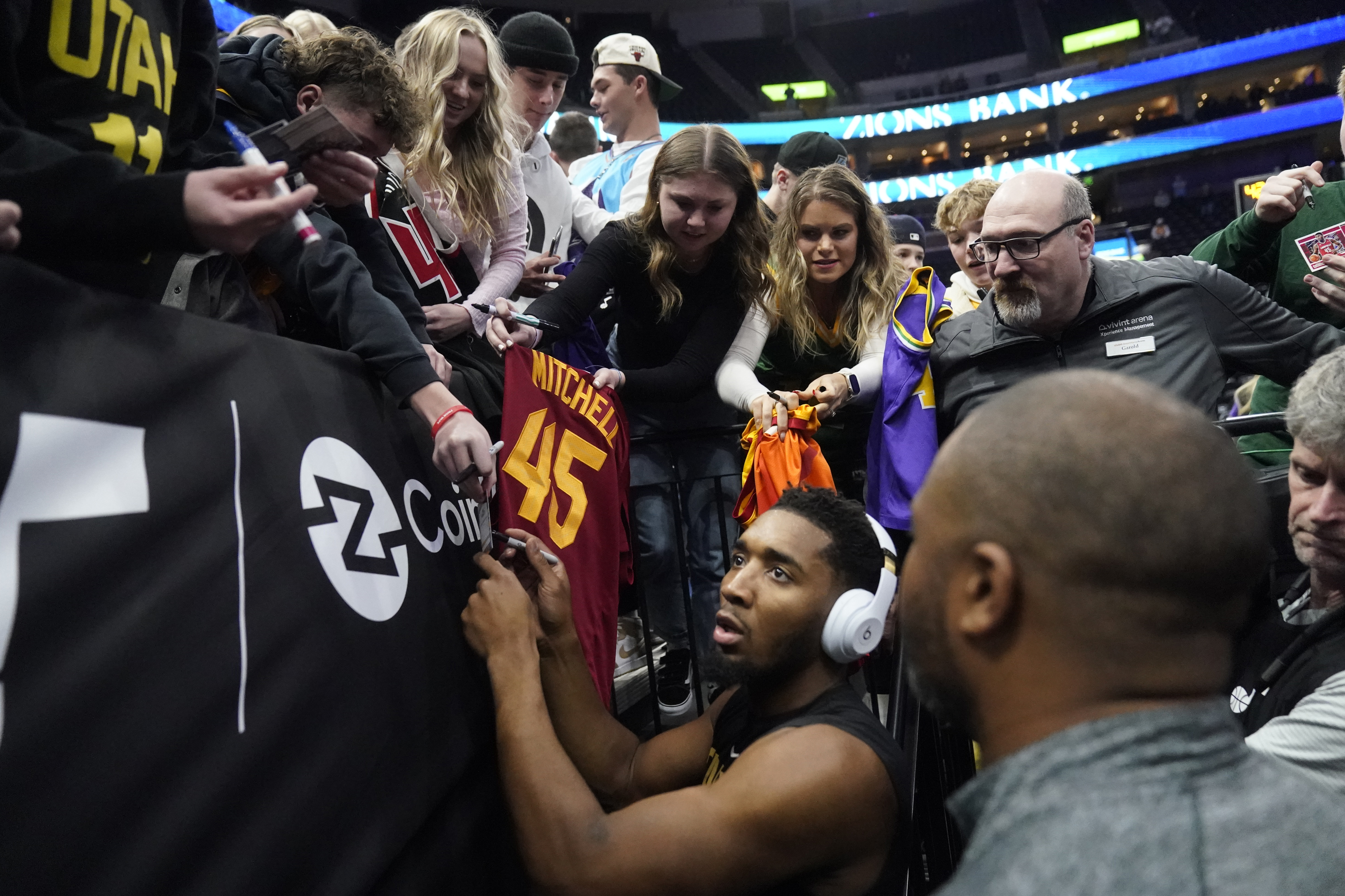 Cleveland Cavaliers guard Donovan Mitchell signs autographs before the team's NBA basketball game against the Utah Jazz on Tuesday, Jan. 10, 2023, in Salt Lake City.