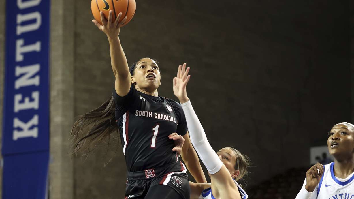 South Carolina's Xaria Wiggins (1) shoots while defended by Kentucky's Maddie Scherr (22) during the first half of an NCAA college basketball game in Lexington, Ky., Thursday, Jan. 12, 2023.