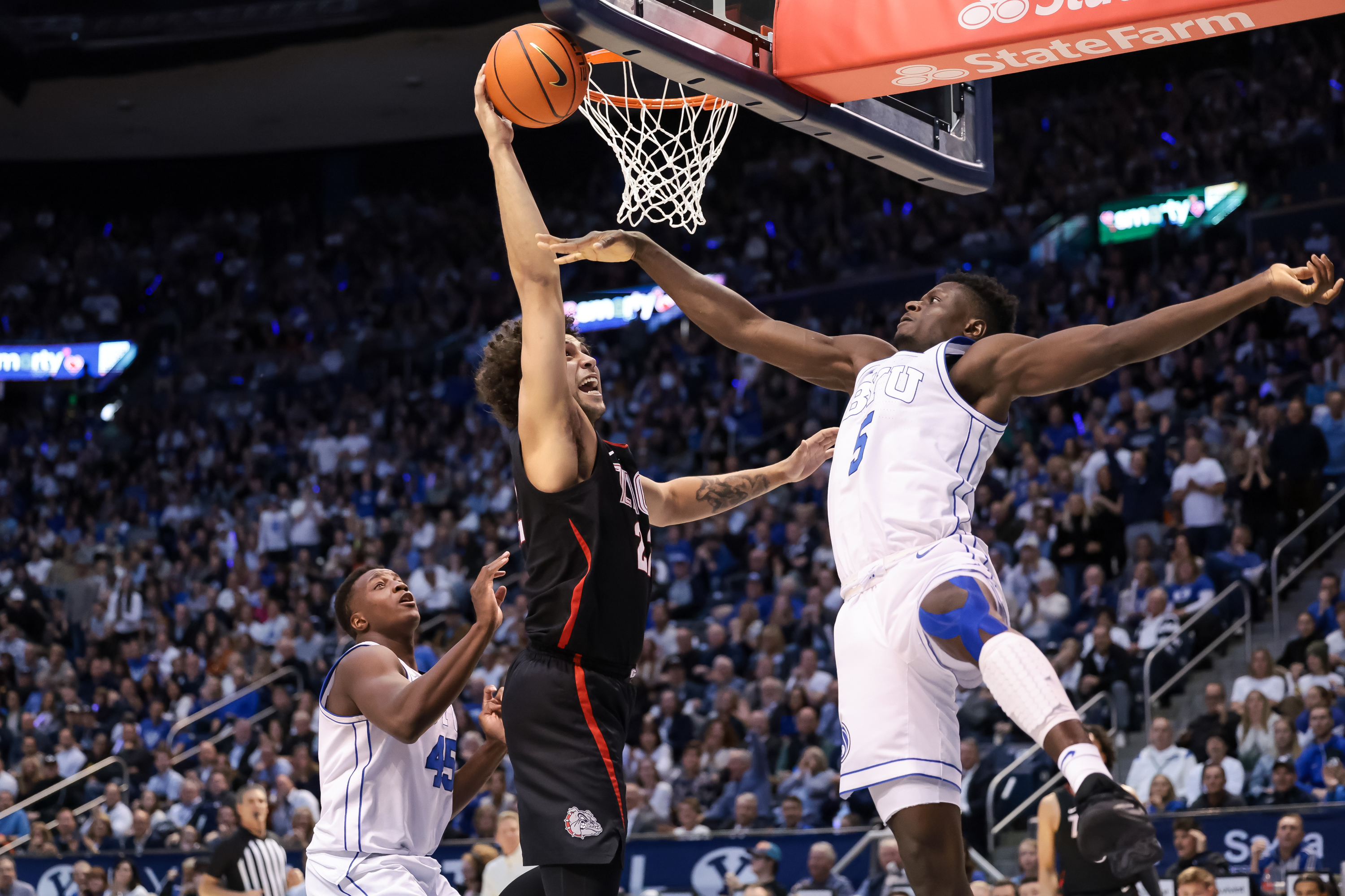 Gonzaga forward Anton Watson (22) goes to the hoop against BYU forward Gideon George (5) during the game at the Marriott Center in Provo on Thursday, Jan. 12, 2023.