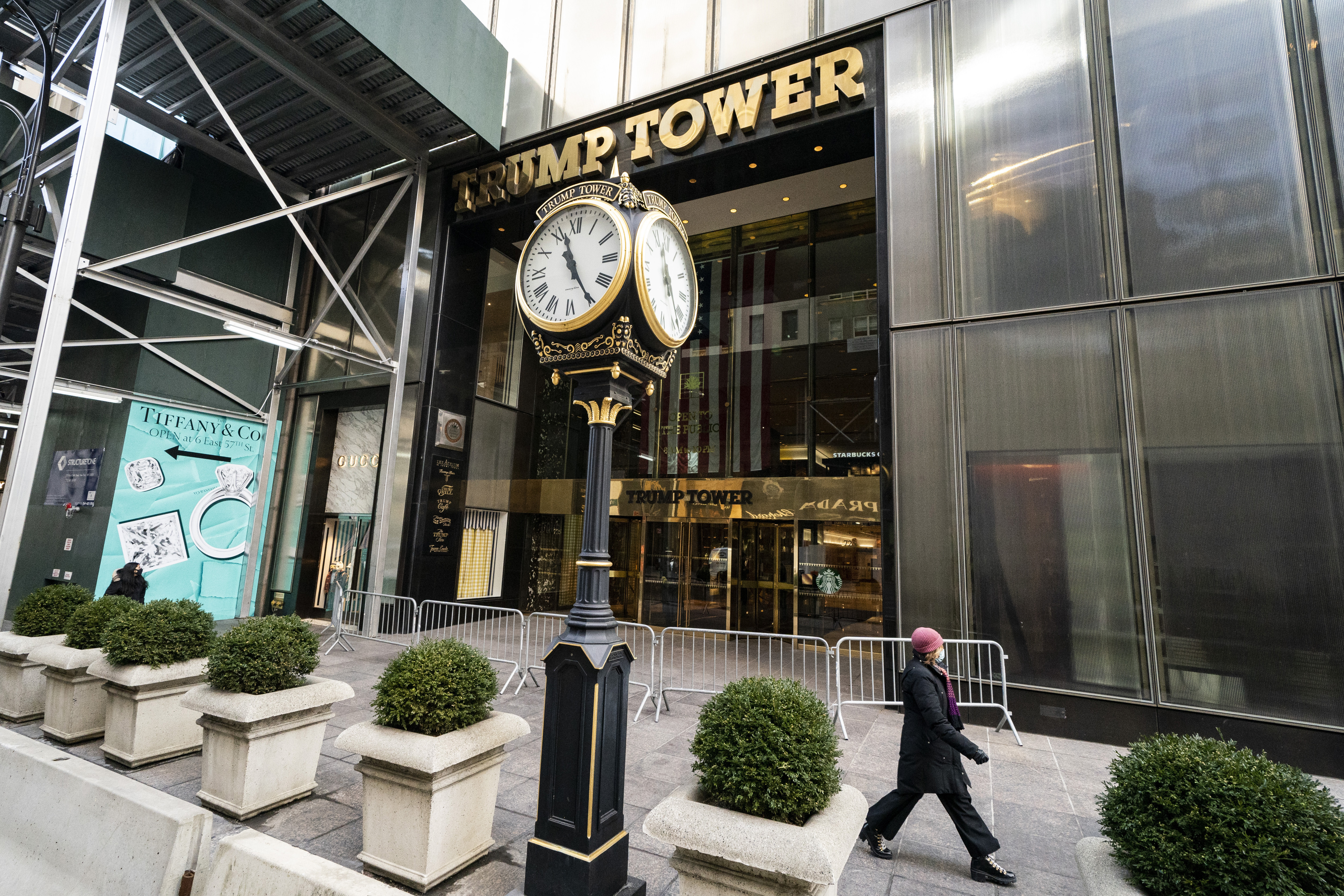 Pedestrians pass in front of Trump Tower, Feb. 17, 2021, in New York. Donald Trump's company was fined $1.6 million on Friday.