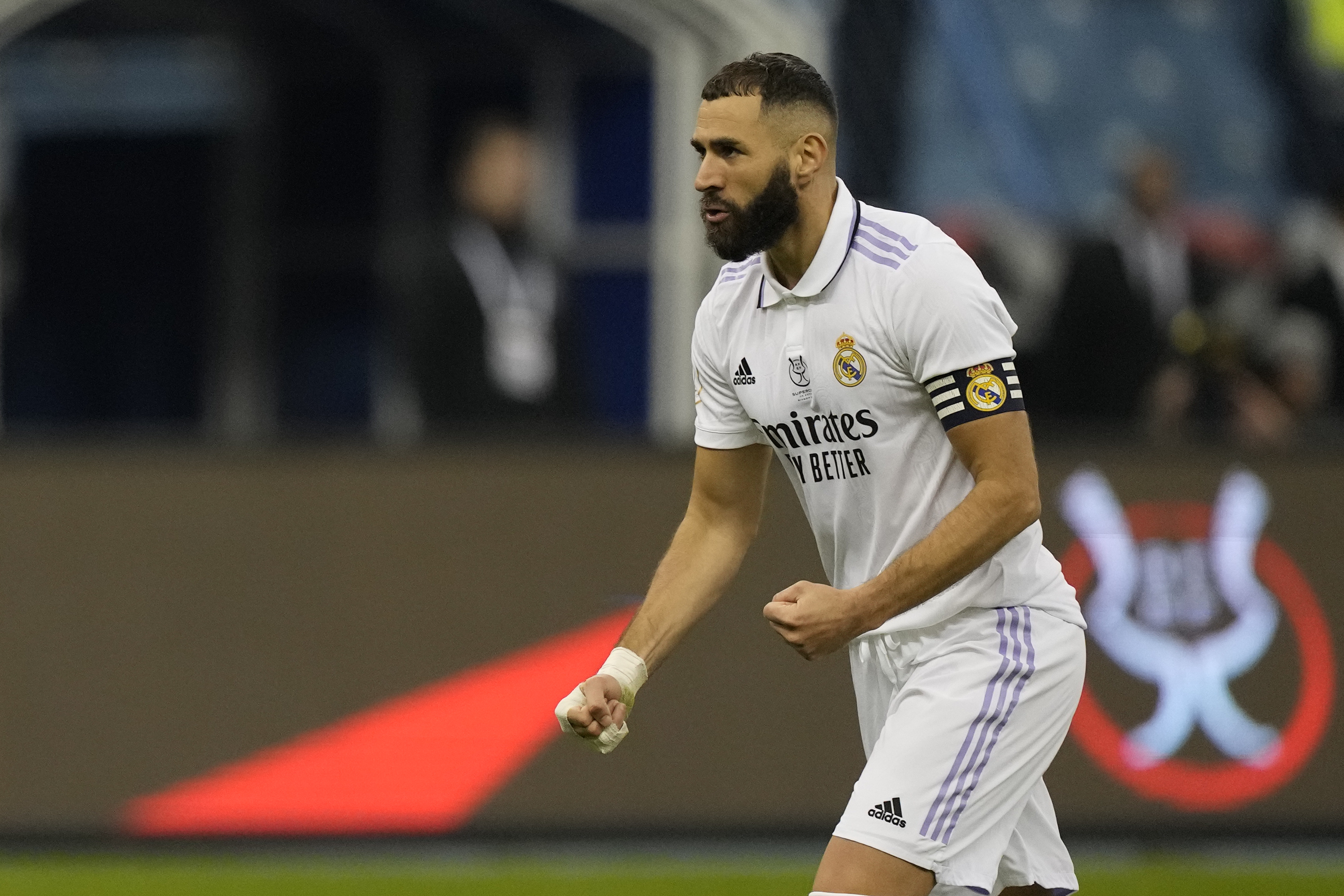 Real Madrid's Karim Benzema reacts after he scored during penalty shootout during a semi-final of the Spanish Super Cup between Real Madrid and Valencia in Riyadh, Saudi Arabia, Wednesday, Jan. 11, 2023. 