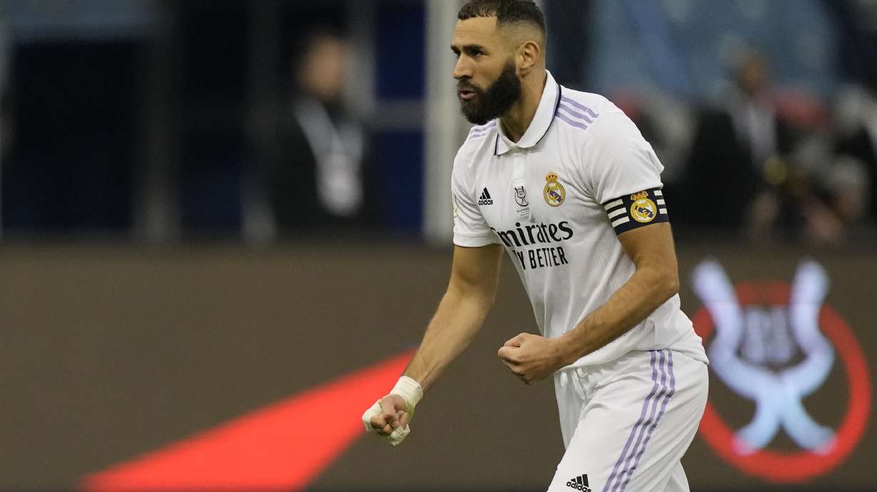 Real Madrid's Karim Benzema reacts after he scored during penalty shootout during a semi-final of the Spanish Super Cup between Real Madrid and Valencia in Riyadh, Saudi Arabia, Wednesday, Jan. 11, 2023.