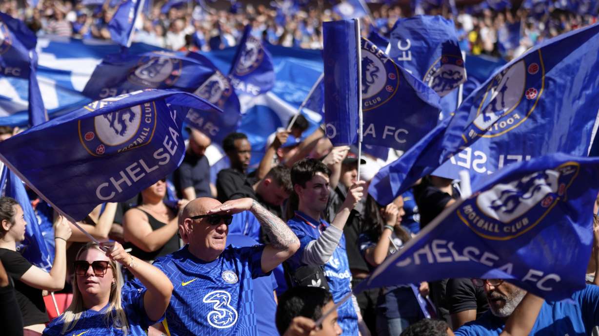 FILE - Chelsea fans support their team before the English FA Cup final soccer match between Chelsea and Liverpool, at Wembley stadium, in London, Saturday, May 14, 2022. Chelsea welcomed the English Football Association's decision to make a homophobic chant aimed at its supporters a punishable offense, calling it a “step in the right direction” on Friday, Jan. 13, 2023.