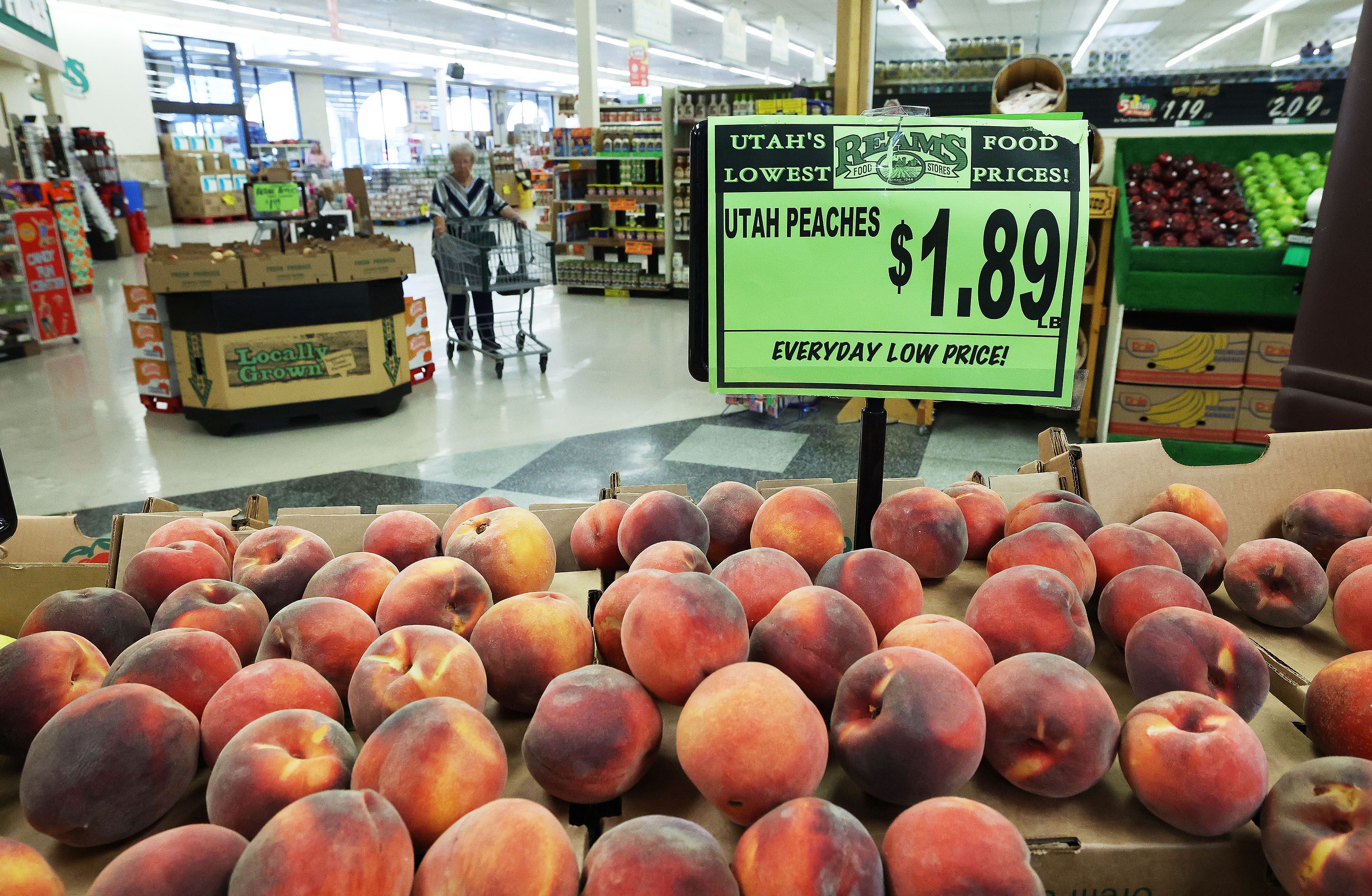 A shopper looks for produce at Reams Food Store in Sandy on Sept. 23, 2022.
