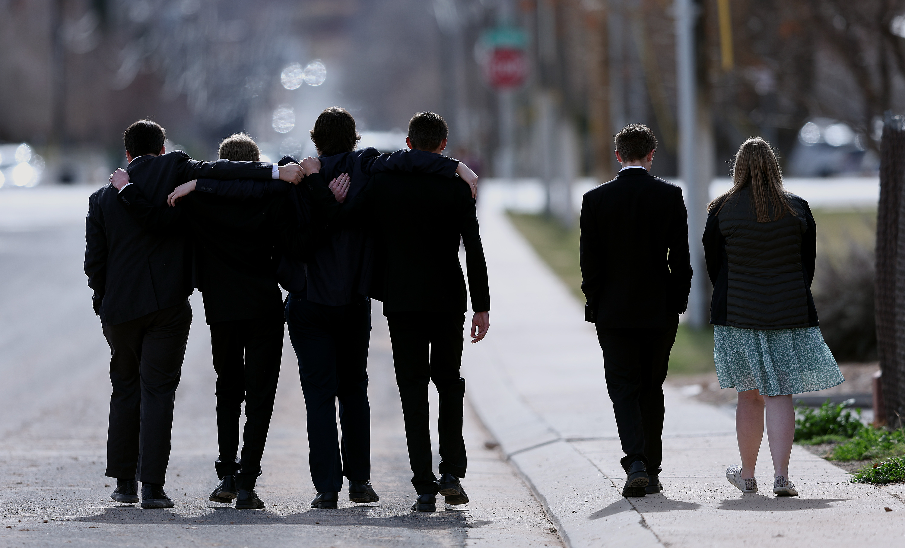 A group of young people leave the cemetery following graveside services in La Verkin, Washington County, for members of the Haight and Earl families on Friday.