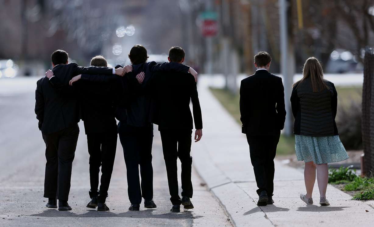A group of young people leave the cemetery following graveside services in La Verkin, Washington County, for members of the Haight and Earl families on Friday.