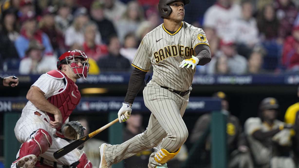 FILE - San Diego Padres right fielder Juan Soto watches his two-run home run during the fifth inning in Game 4 of the baseball NL Championship Series between the San Diego Padres and the Philadelphia Phillies on Saturday, Oct. 22, 2022, in Philadelphia. Outfielder Juan Soto agreed to a $23 million, one-year contract with the San Diego Padres on Friday, Jan. 13, 2023, a raise from his $17.1 million salary last season.