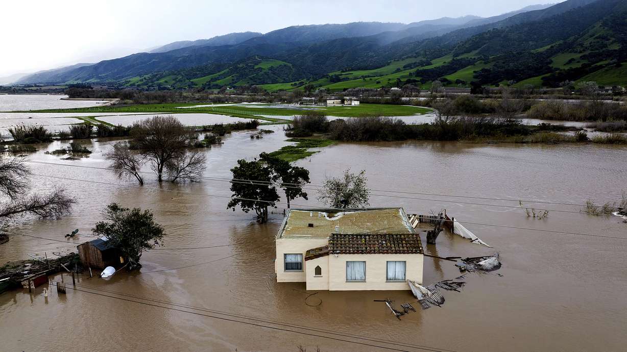 Floodwaters surround a home in the Chualar community of Monterey County, Calif., as the Salinas River overflows its banks on Friday.