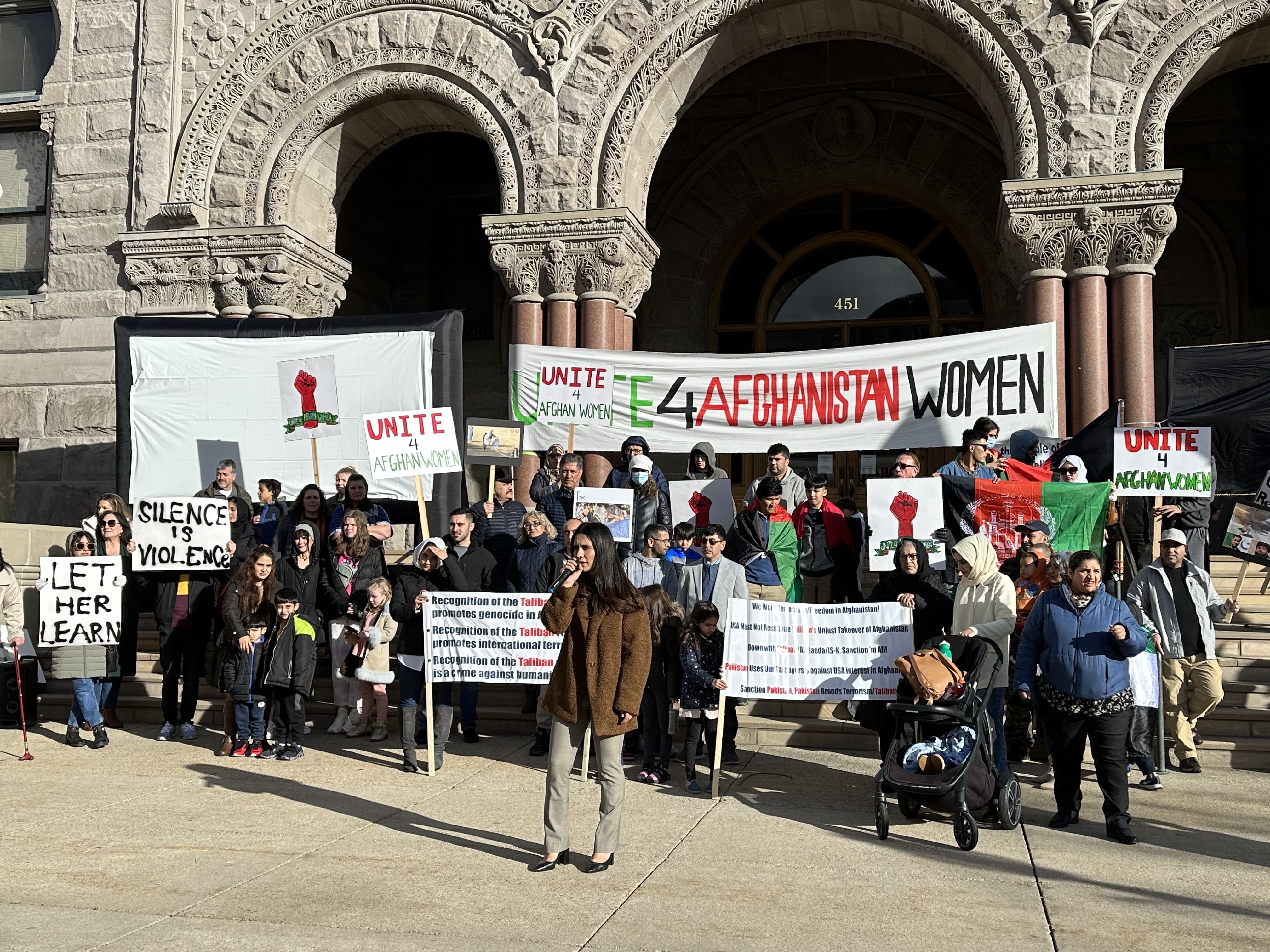 Crystal Bayat speaks to Afghan refugees and Utahns about the Taliban's actions against women in Afghanistan during a demonstration at Washington Square Park in Salt Lake City on Jan. 14.
