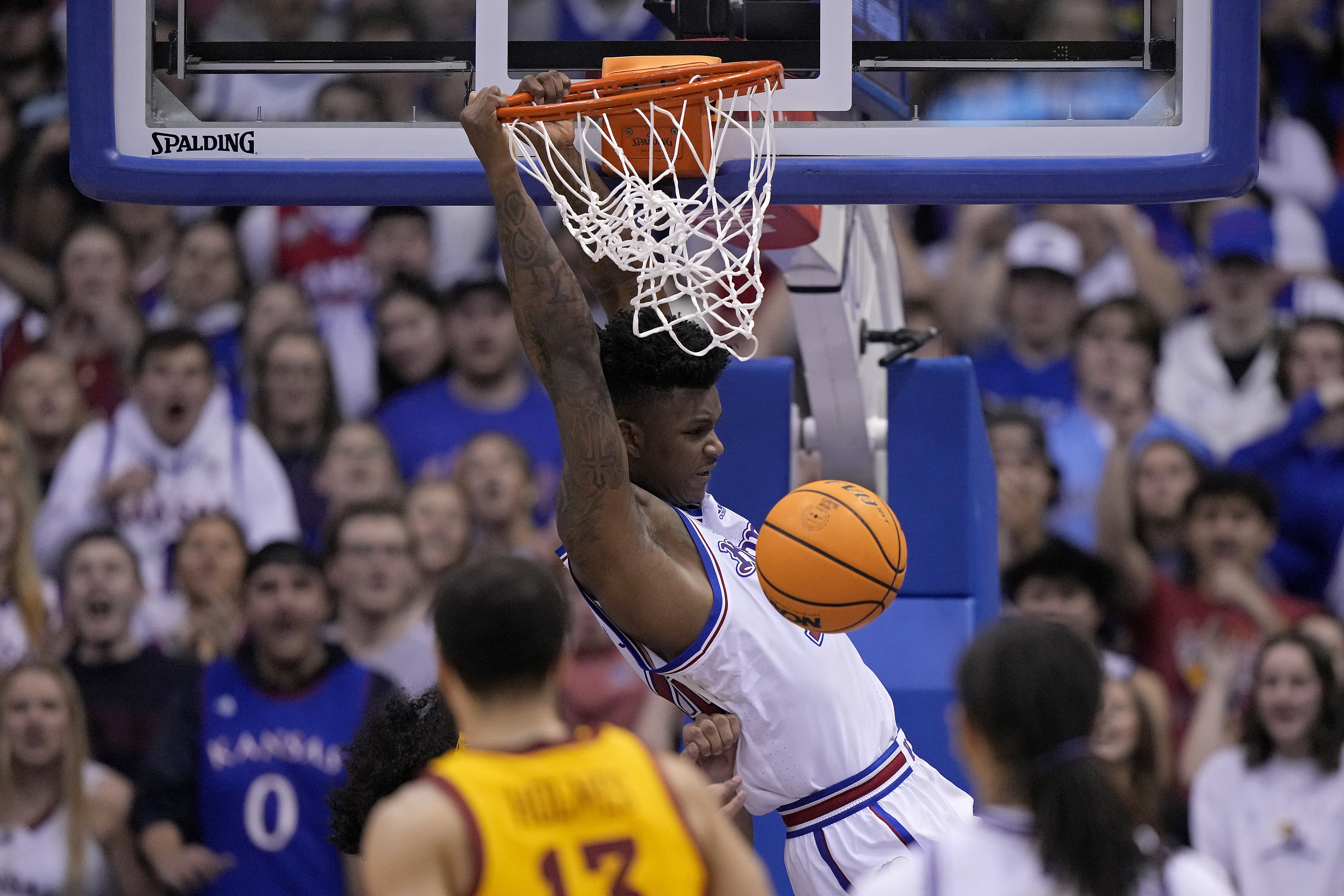 Kansas forward K.J. Adams Jr. (24) dunks the ball during the second half of an NCAA college basketball game against Iowa State Saturday, Jan. 14, 2023, in Lawrence, Kan. Kansas won 62-60