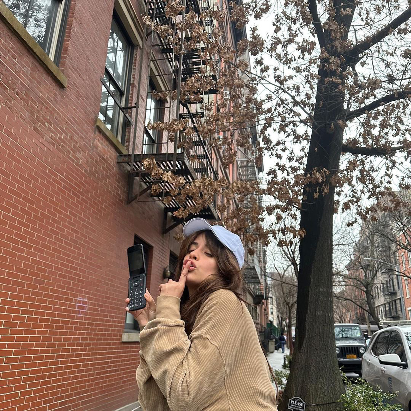 Camila Cabello with her flip phone. "I'm team flip phone revolution," singer Camila Cabello tweeted Thursday, posing with a TCL flip phone, vintage. "Maybe I can write the theme song."