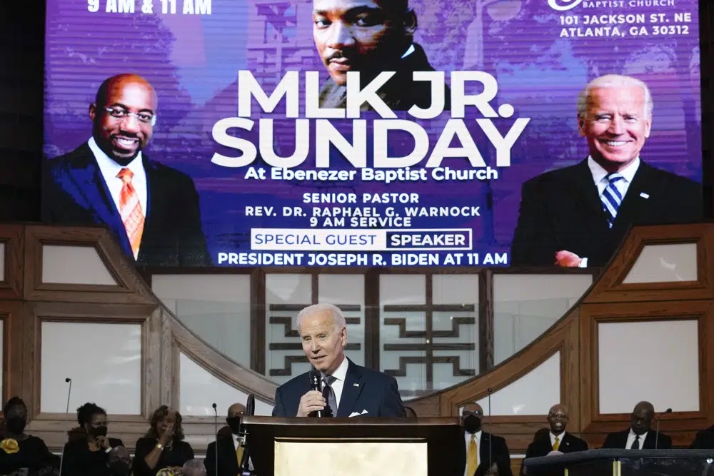 President Joe Biden speaks at Ebenezer Baptist Church in Atlanta, Sunday during a service honoring Martin Luther King Jr. Biden made a historical pilgrimage Sunday to "America's freedom church" to mark Martin Luther King Jr.'s birthday.