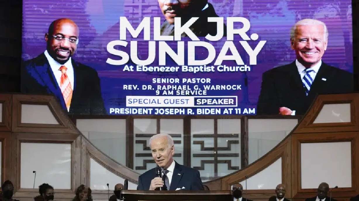 President Joe Biden speaks at Ebenezer Baptist Church in Atlanta, Sunday during a service honoring Martin Luther King Jr. Biden made a historical pilgrimage Sunday to "America's freedom church" to mark Martin Luther King Jr.'s birthday.