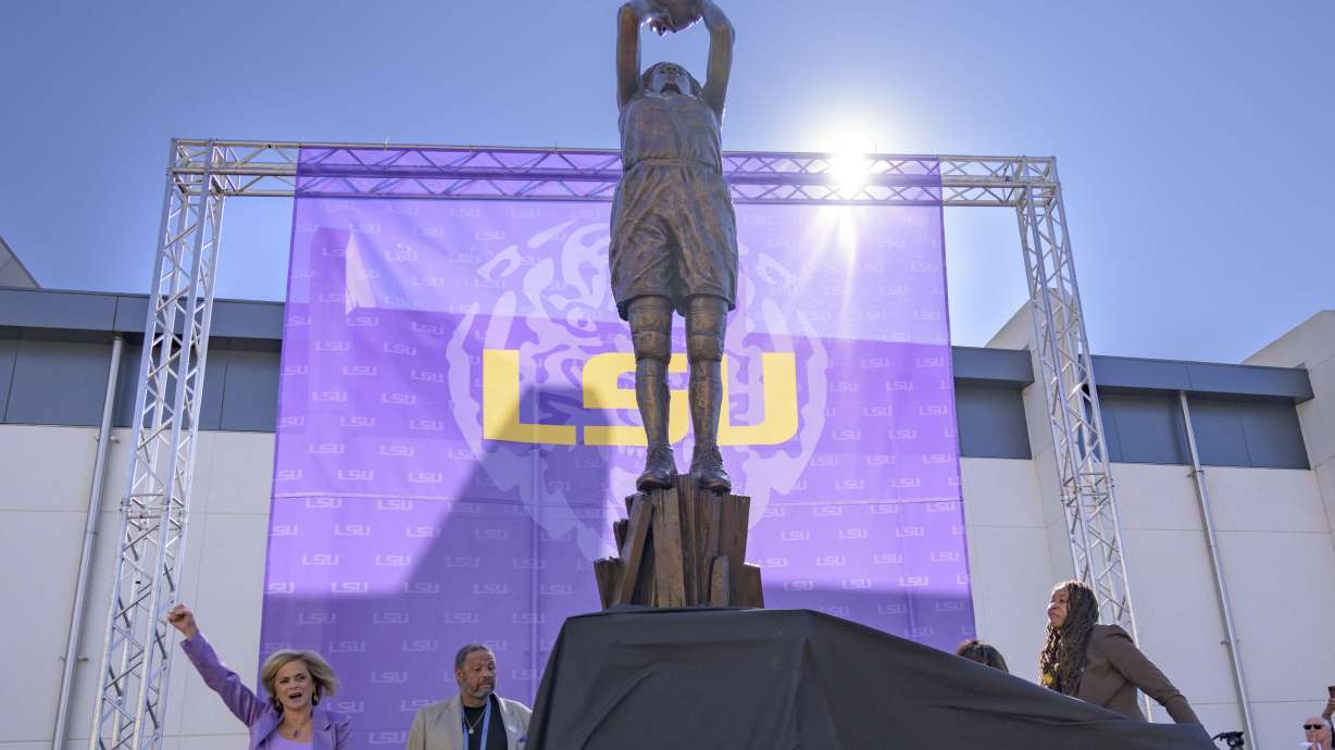 Seimone Augustus, right, a former LSU player who lead her team to multiple final fours and a Minnesota Lynx player who won four WNBA Championships, unveils her statue with LSU head coach Kim Mulkey, left, at the LSU campus on Sunday, Jan. 15, 2023, in Baton Rouge, La.