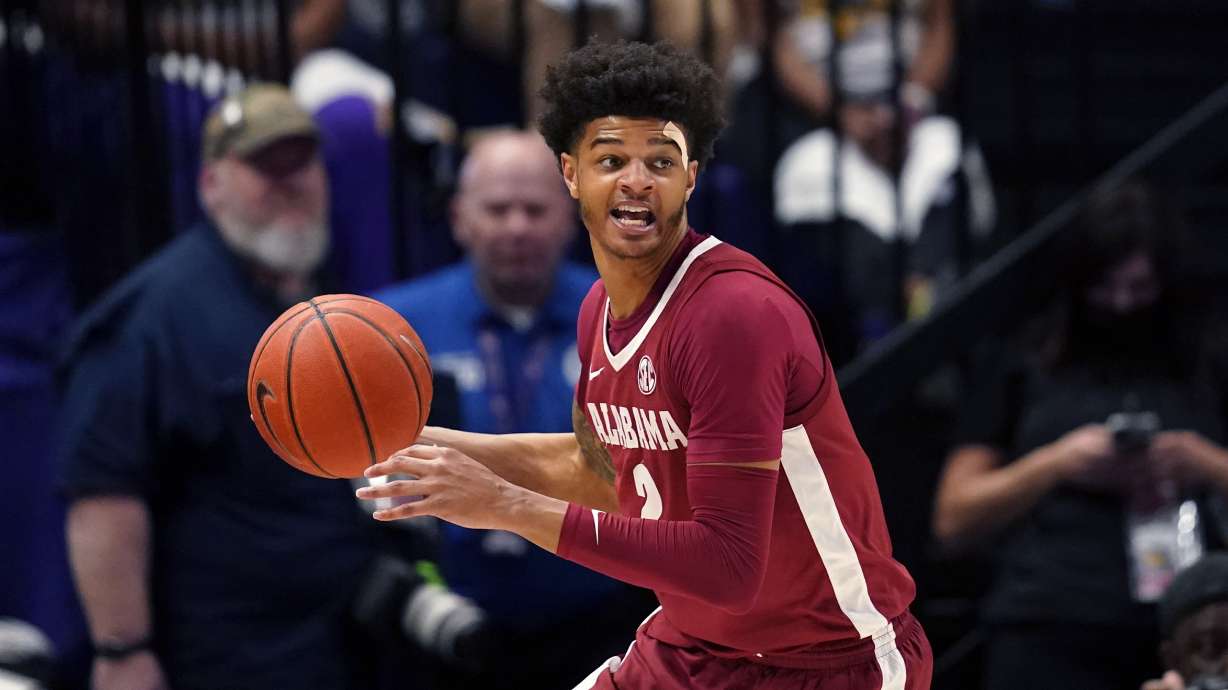 FILE - Alabama forward Darius Miles looks to pass in the second half an NCAA college basketball game against LSU in Baton Rouge, La., March 5, 2022. Miles is one of two suspects charged with capital murder in a predawn deadly shooting on the Strip in Tuscaloosa, Ala., Sunday, Jan. 15, 2023.