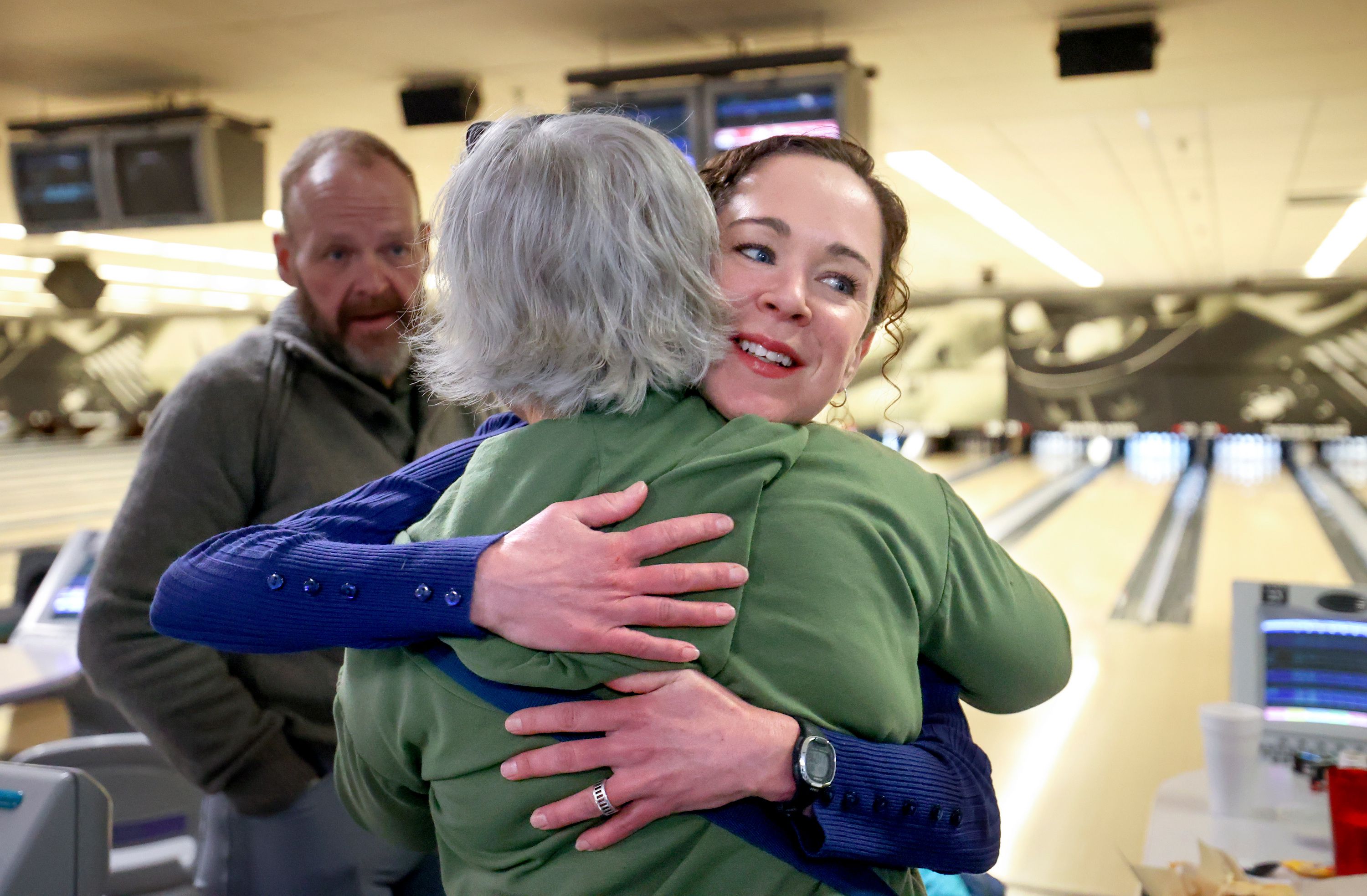Veterans Affairs LCSW Bronwyn Powell, right, hugs retired Air National Guard Master Sgt. Lori Salas, after bowling with Continue Mission, an organization that helps veterans with suicide prevention and mental health, at Delton Lanes in West Valley City on Jan. 5.