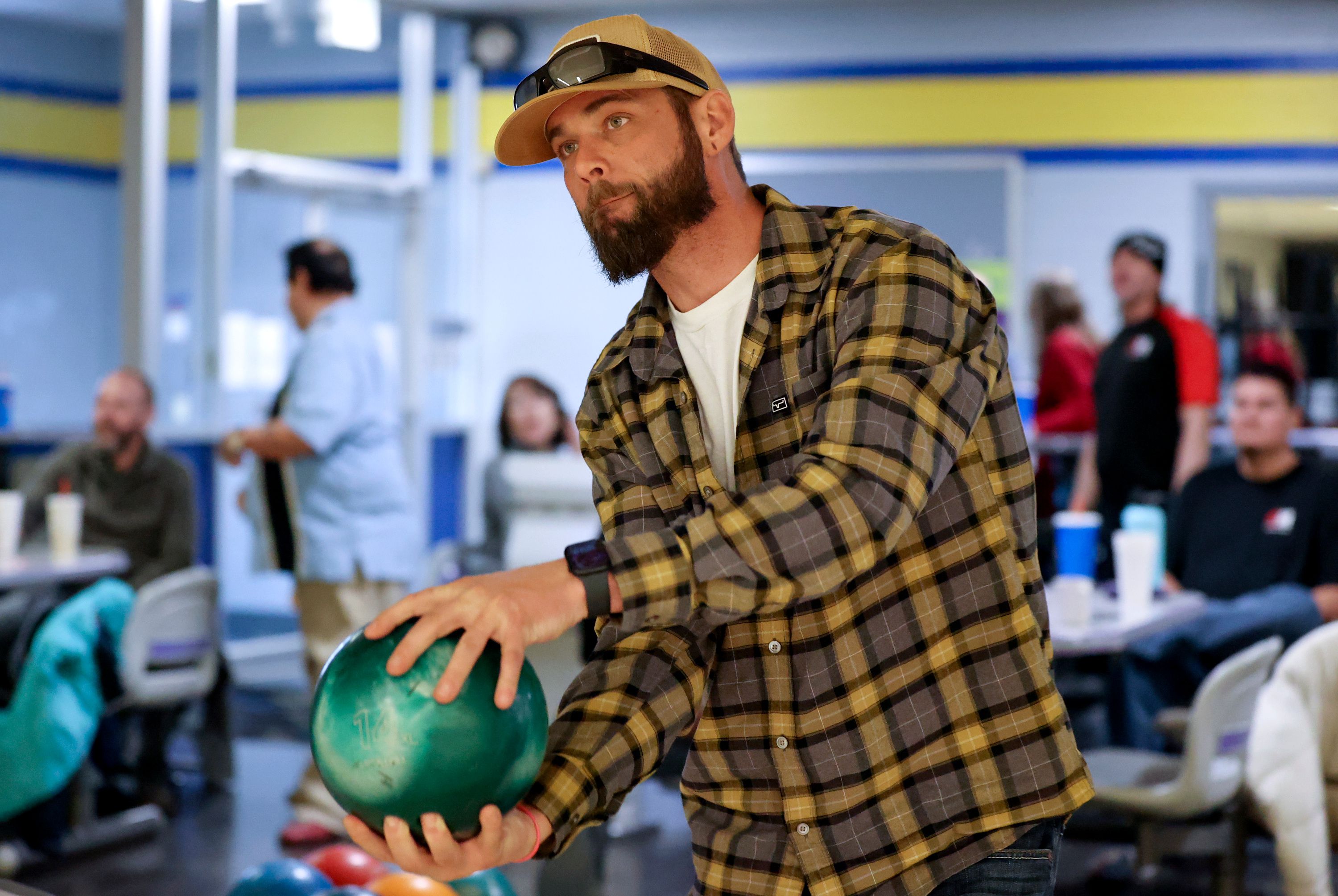 Medically retired Army combat medic Nicholaus Connole bowls with Continue Mission, an organization that helps veterans with suicide prevention and mental health, at Delton Lanes in West Valley City on Jan. 5.