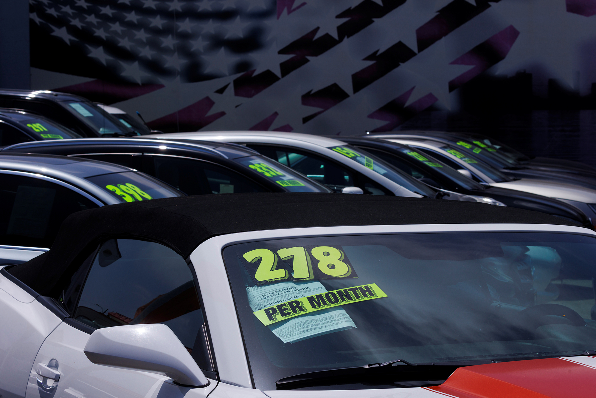 Pictured is car dealership in National City, Calif., in June, 2022. Used cars prices have dropped in December. 