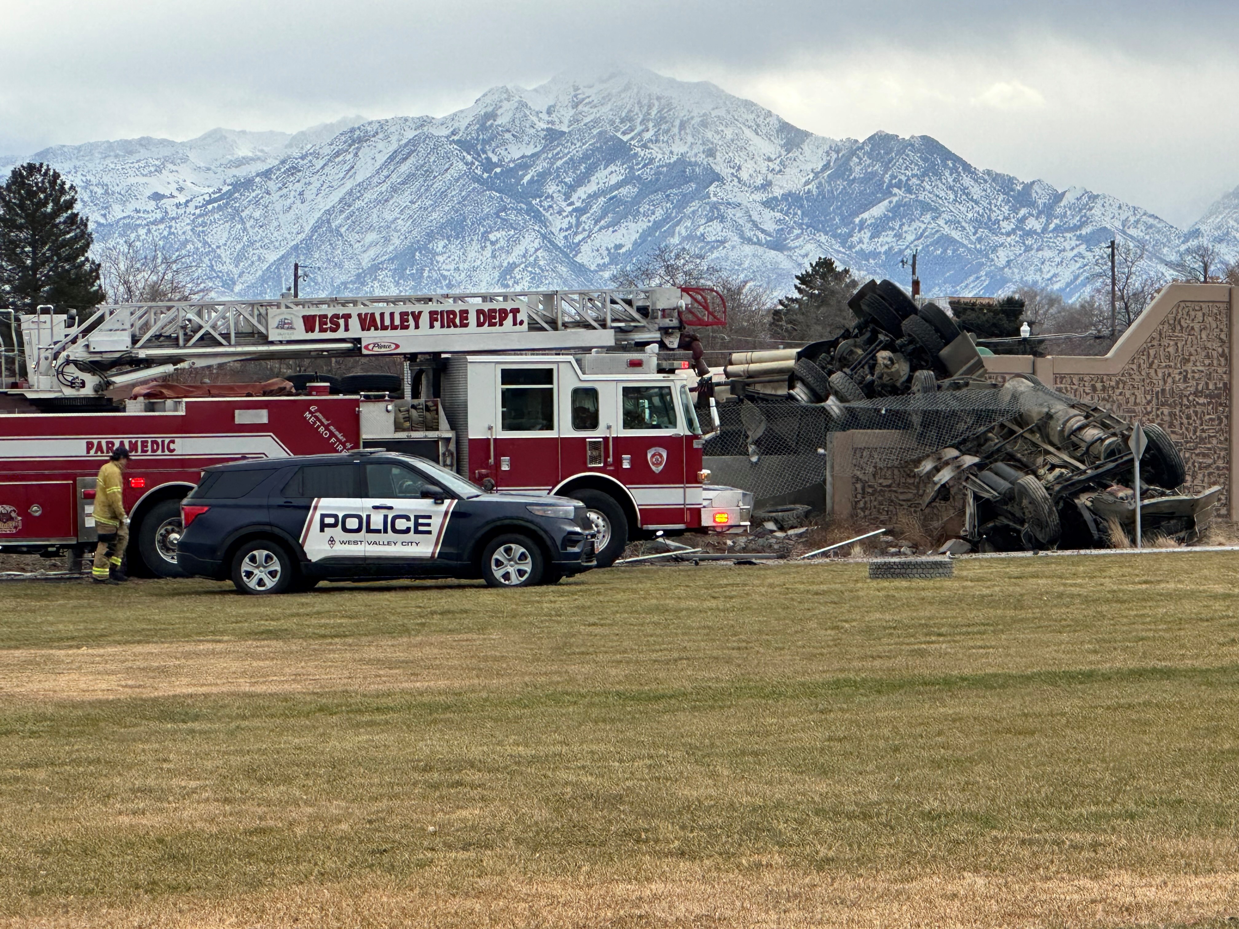 Emergency crews respond to a fatal rollover crash at the intersection of 3500 South and Mountain View Corridor in West Valley City Monday morning. 