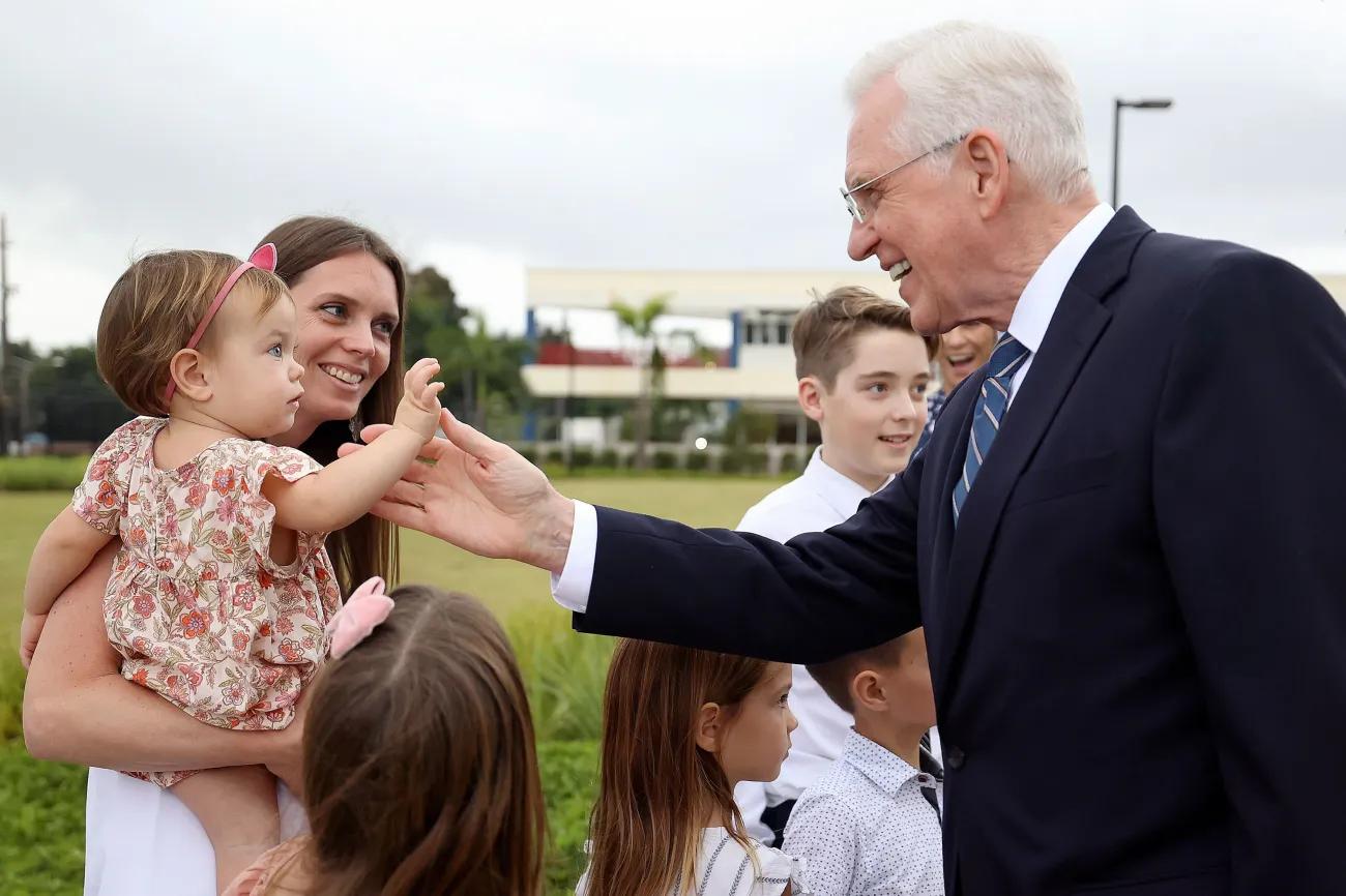 Elder D. Todd Christofferson, of the Quorum of the Twelve Apostles, greets Britney Nielsen and her mother Jalene Nielsen as he leaves the San Juan Puerto Rico Temple dedication in San Juan, Puerto Rico, on Sunday, Jan. 15, 2023.
