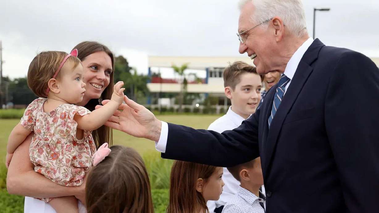 Elder D. Todd Christofferson, of the Quorum of the Twelve Apostles, greets Britney Nielsen and her mother Jalene Nielsen as he leaves the San Juan Puerto Rico Temple dedication in San Juan, Puerto Rico, on Sunday, Jan. 15, 2023.