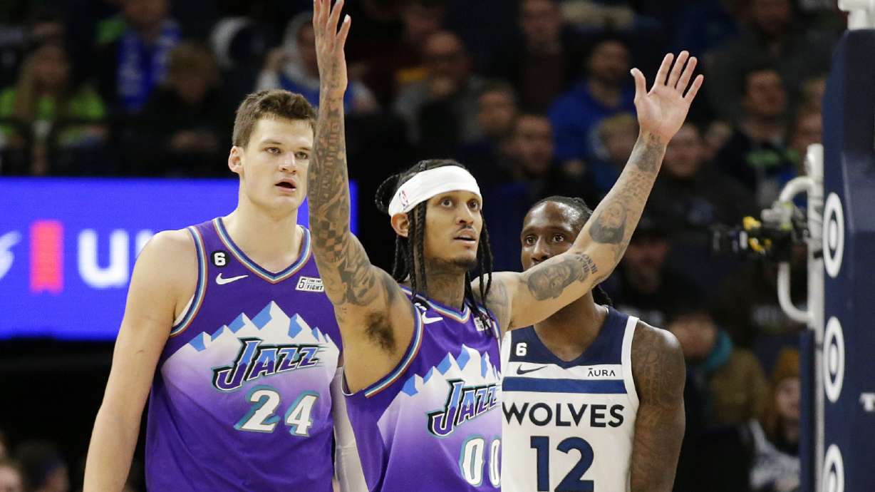 Utah Jazz guard Jordan Clarkson (00) celebrates after a basket as Jazz center Walker Kessler (24) and Minnesota Timberwolves forward Taurean Prince (12) look on in the third quarter during an NBA basketball game Monday, Jan. 16, 2023, in Minneapolis.