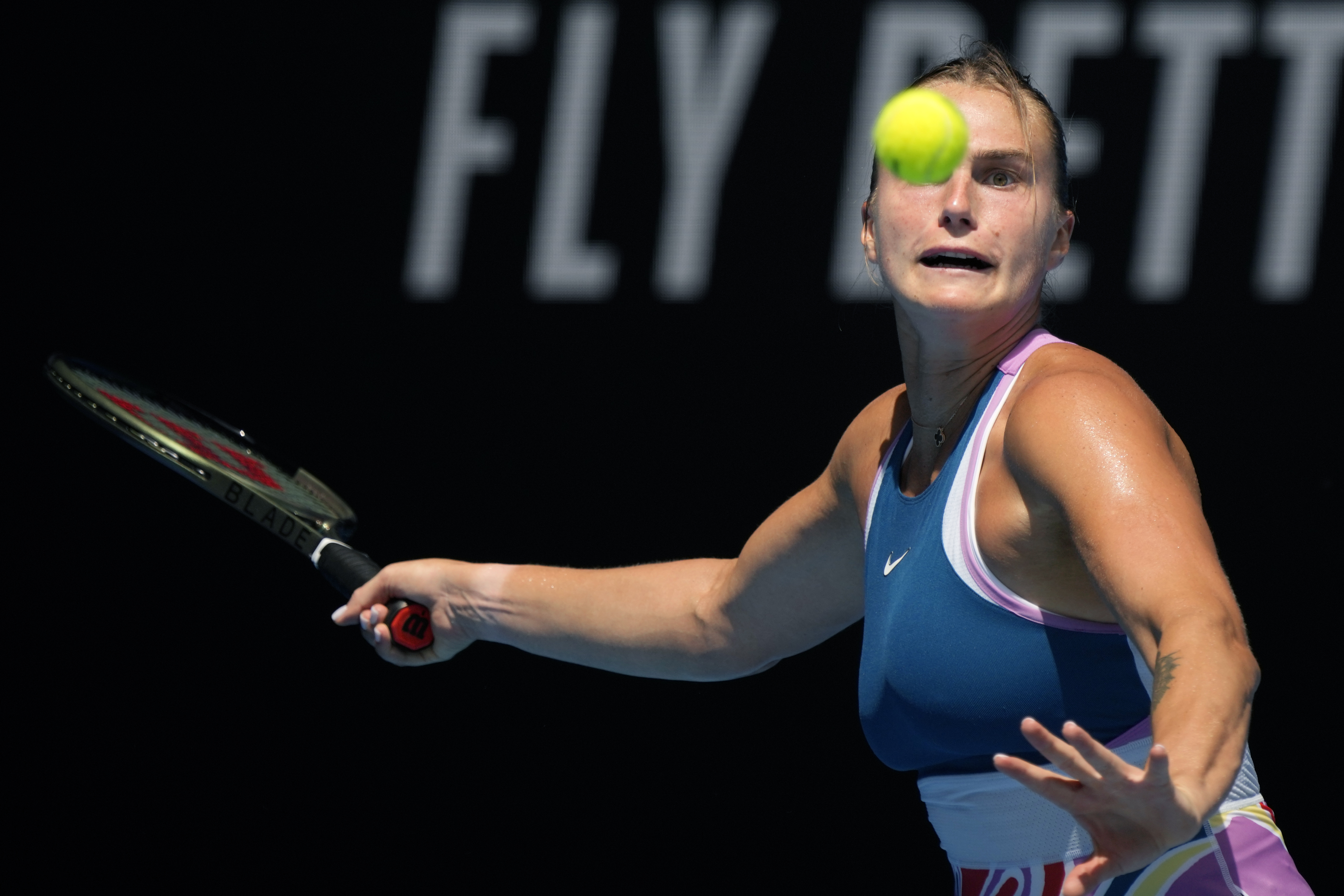 Aryna Sabalenka of Belarus plays a forehand return to Tereza Martincova of the Czech Republic during their first round match at the Australian Open tennis championship in Melbourne, Australia, Tuesday, Jan. 17, 2023. 