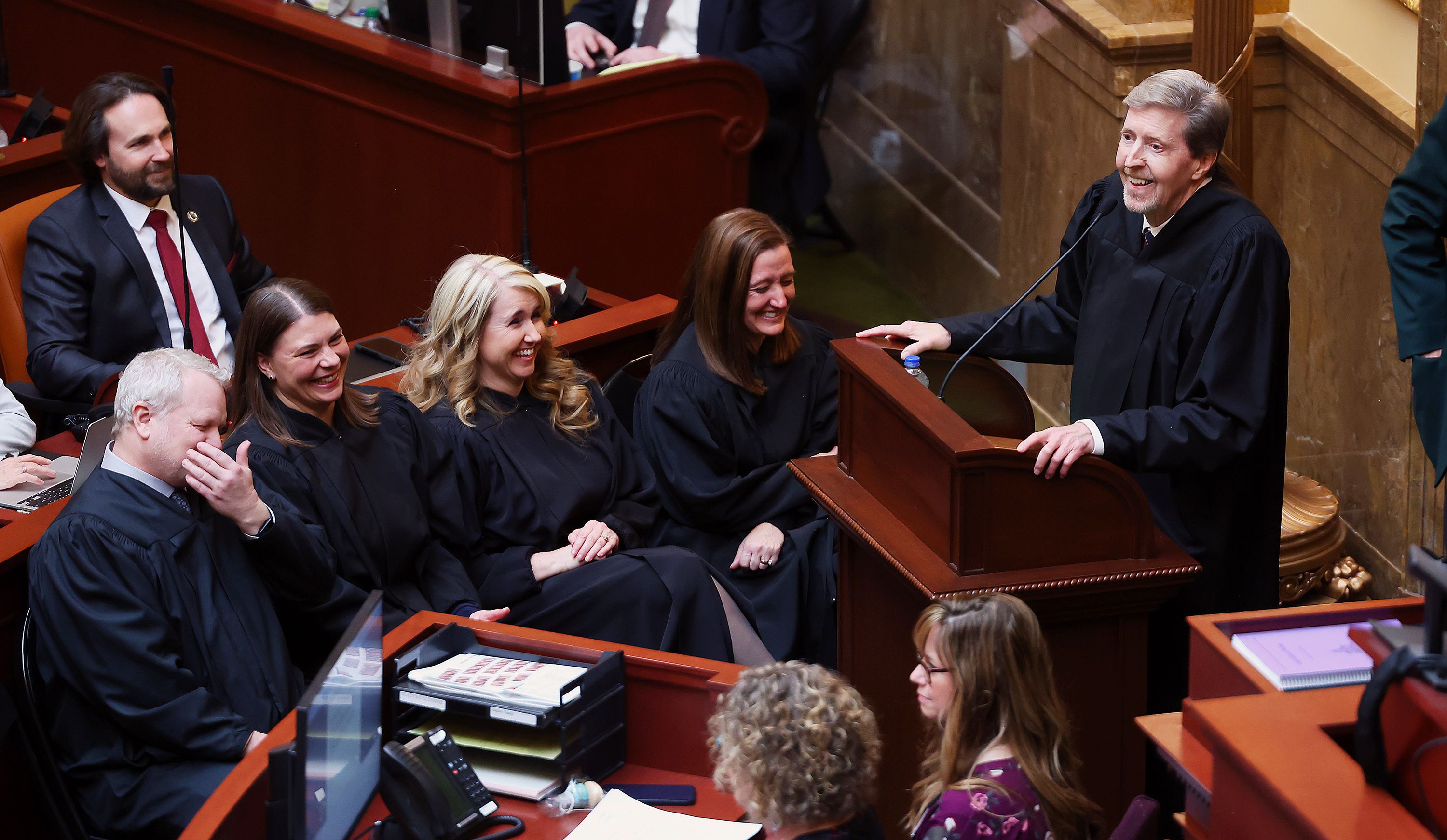 Associate Chief Justice John A. Pearce, Justice Paige Petersen, Justice Diana Hagen and Justice Jill M. Pohlman laugh after a comment as they listen to Utah Chief Justice Matthew B. Durrant giving the state of the judiciary speech in the House of Representatives during the opening day of the 2023 legislative session at the Capitol in Salt Lake City on Tuesday.