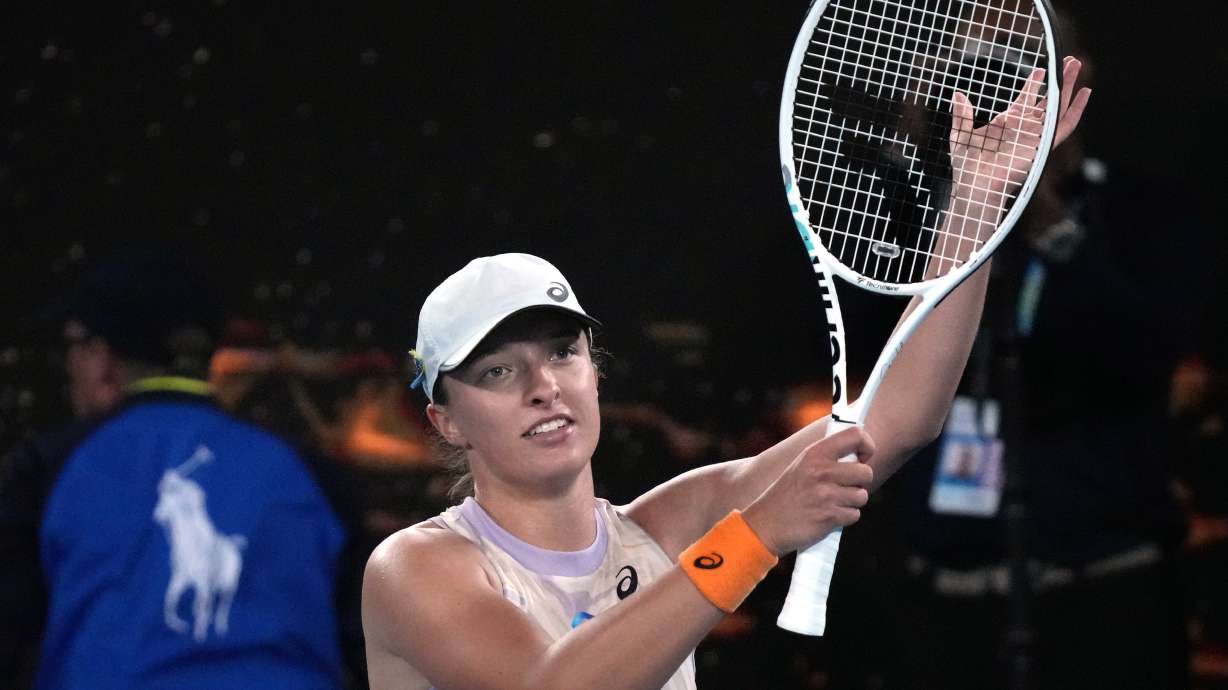 Iga Swiatek of Poland celebrates after defeating Camila Osorio of Colombia in their second round match at the Australian Open tennis championship in Melbourne, Australia, Wednesday, Jan. 18, 2023.