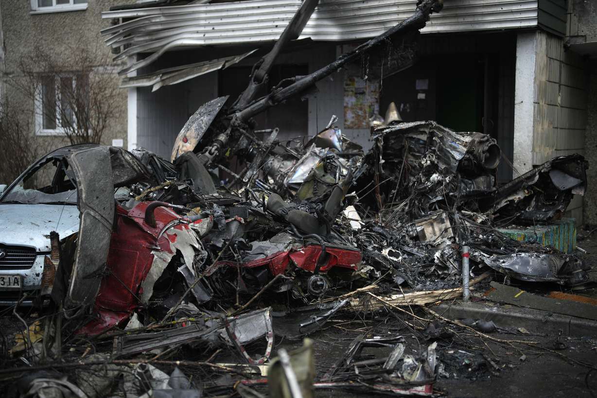 A view of the scene where a helicopter crashed on civil infrastructure in Brovary, on the outskirts of Kyiv, Ukraine, Wednesday.