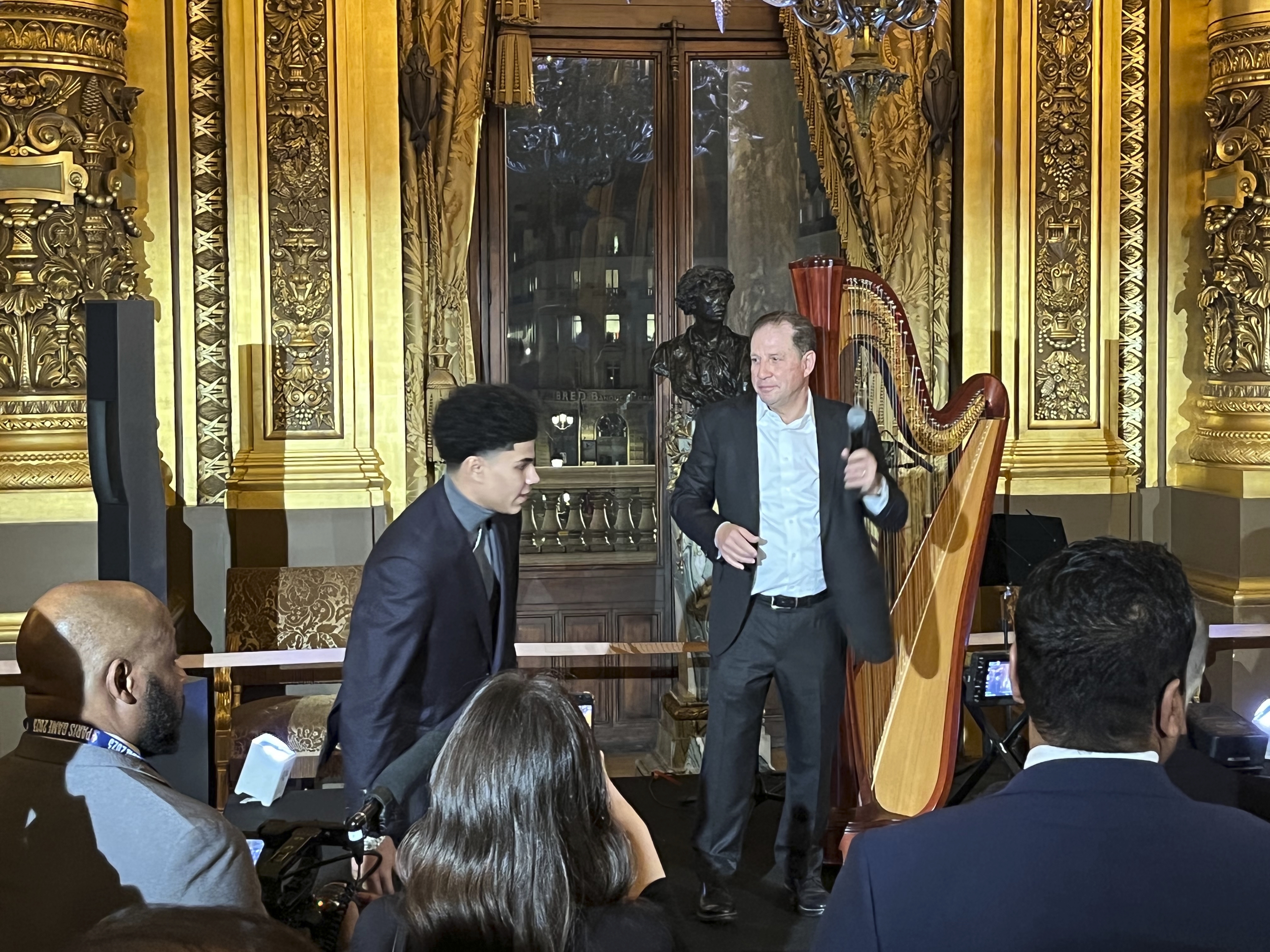 Detroit Pistons vice chairman Arn Tellem welcomes the NBA basketball team and their families to a private party at the Paris Opera House Tuesday night, Jan. 17, 2023, in Paris, France. At top left is Pistons' Killian Hayes. The Detroit Pistons play the Chicago Bulls in Paris on Thursday. 