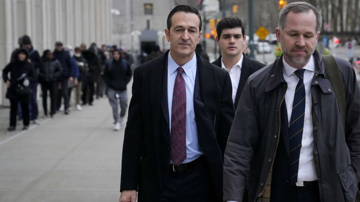 Former 21st Century Fox executive Hernan Lopez, left,wld arrives to Federal court in Brooklyn, Tuesday, Jan. 17, 2023, in New York.