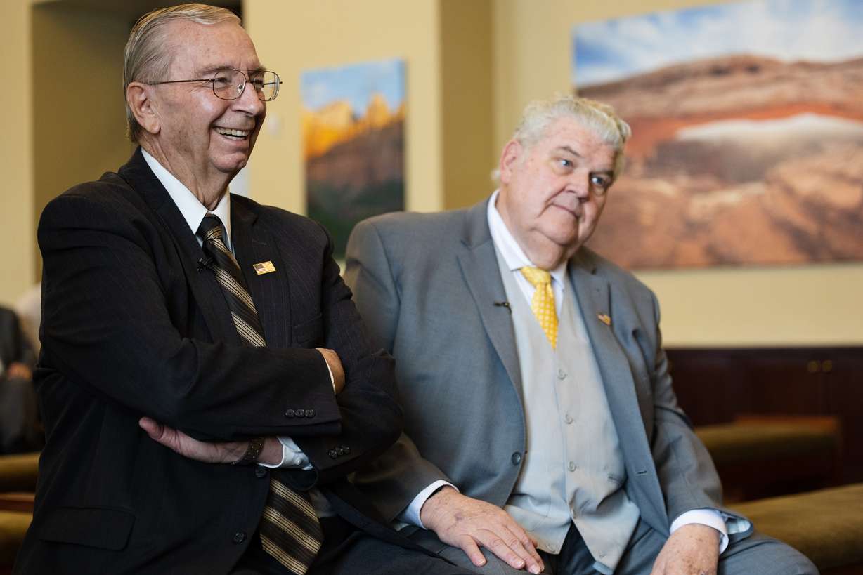Retired Utah Highway Patrol trooper Ralph Evans, left, laughs during a press conference at the state Capitol in Salt Lake City on Wednesday. After being shot during a routine traffic stop, Evans was saved by Dr. Stanley Green on Oct. 7, 1978.