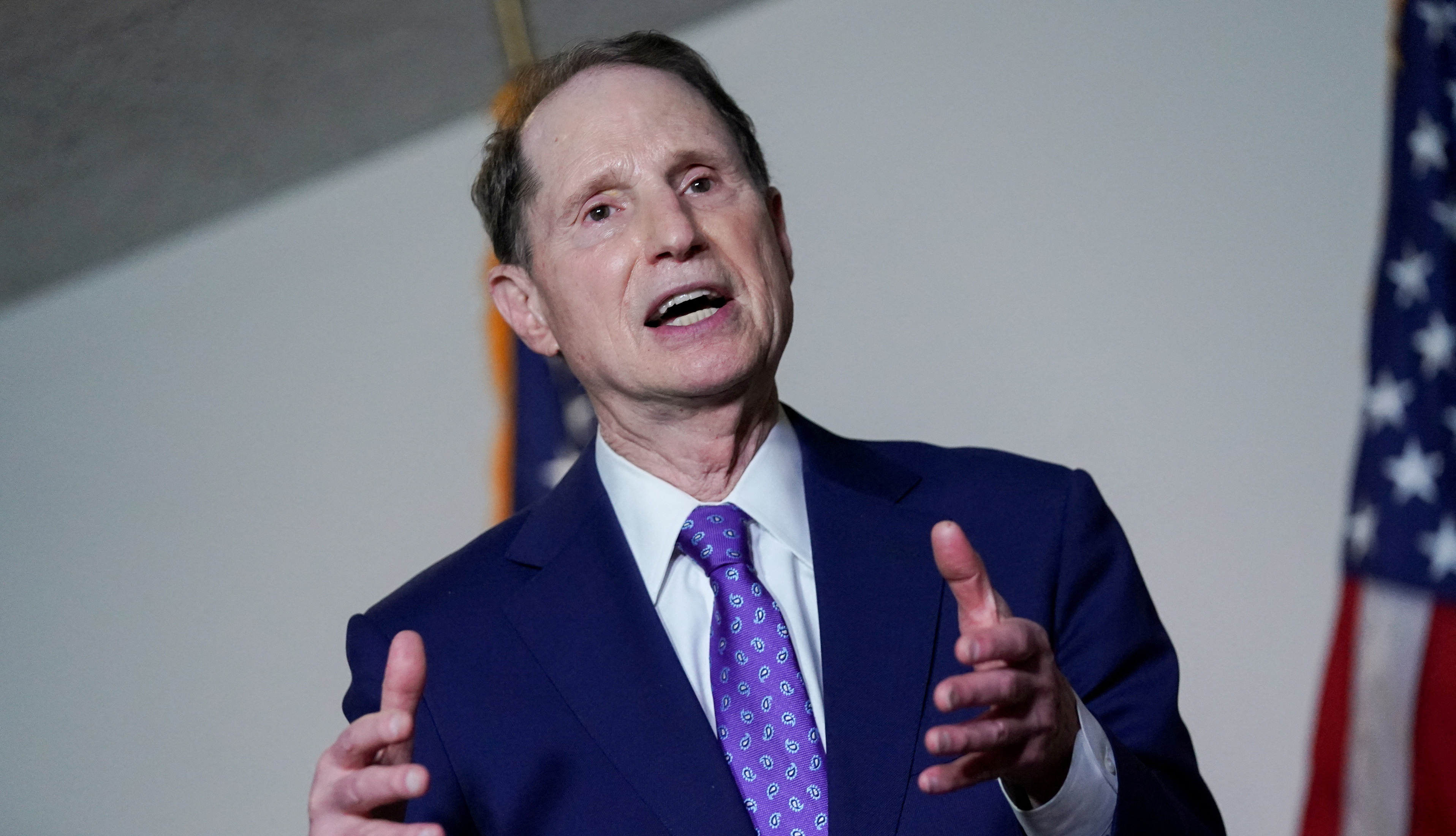 Sen. Ron Wyden, D-Ore., speaks during a news conference after a Democratic luncheon meeting in Washington on April 13, 2021. Wyden on Wednesday called for the Justice Department inspector general to investigate federal, state and local law enforcement access to a massive money transfer database.