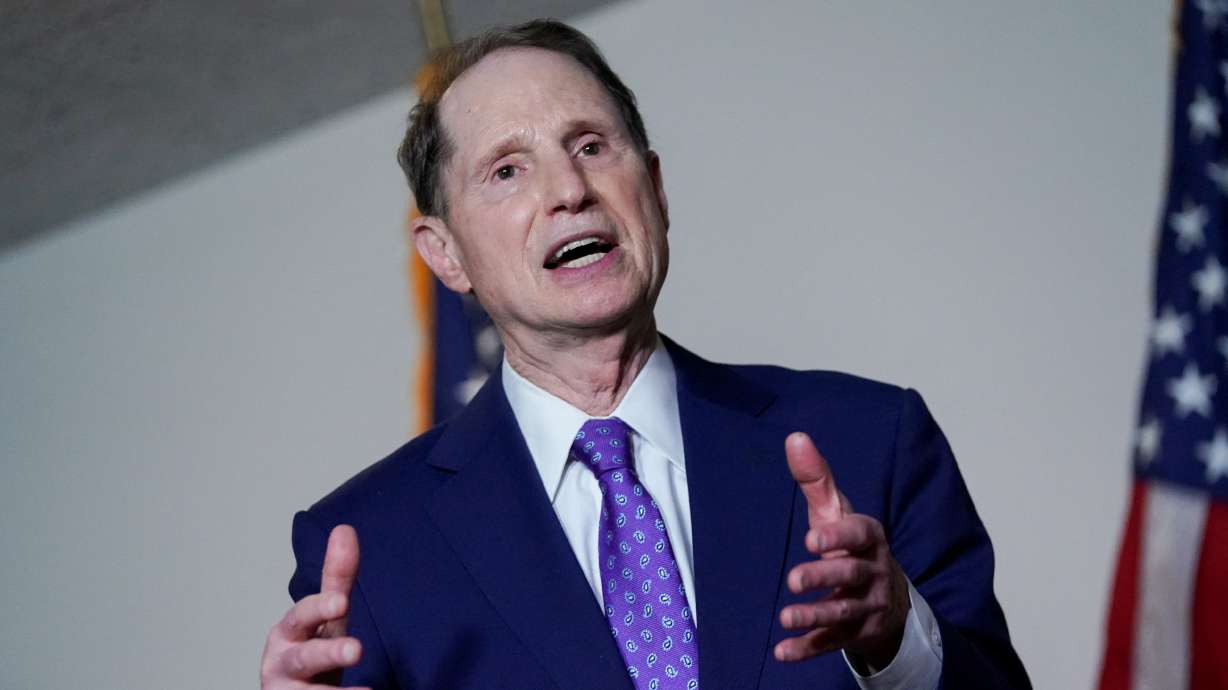 Sen. Ron Wyden, D-Ore., speaks during a news conference after a Democratic luncheon meeting in Washington on April 13, 2021. Wyden on Wednesday called for the Justice Department inspector general to investigate federal, state and local law enforcement access to a massive money transfer database.